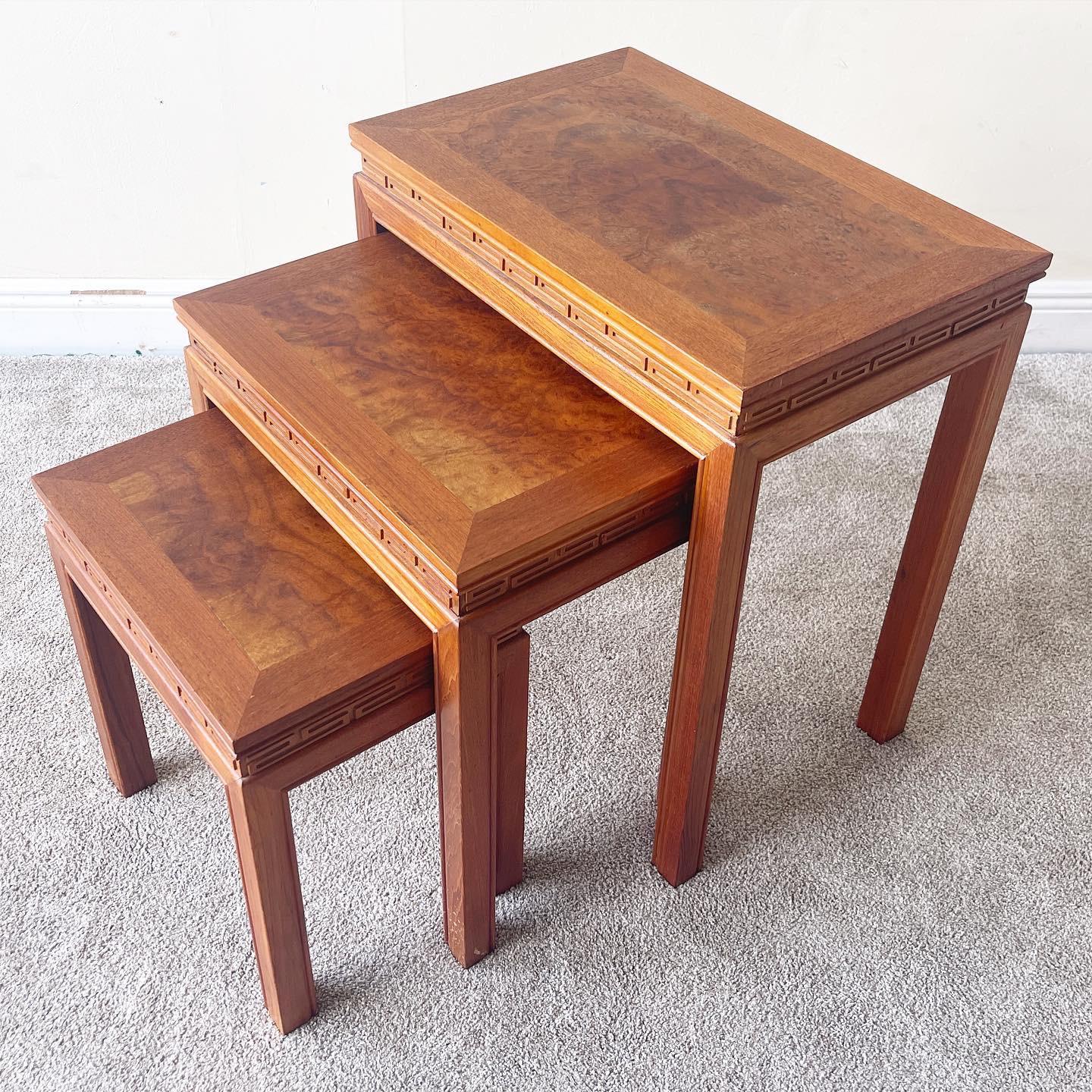 Excellent set of 3 hand carved cherry nesting tables. Each table features a centered Burl Wood veneer

Additional information: 
Material: Burlwood, Veneer
Color: Brown
Style: Asian
Time Period: 1960s
Dimension:
Large: 22
