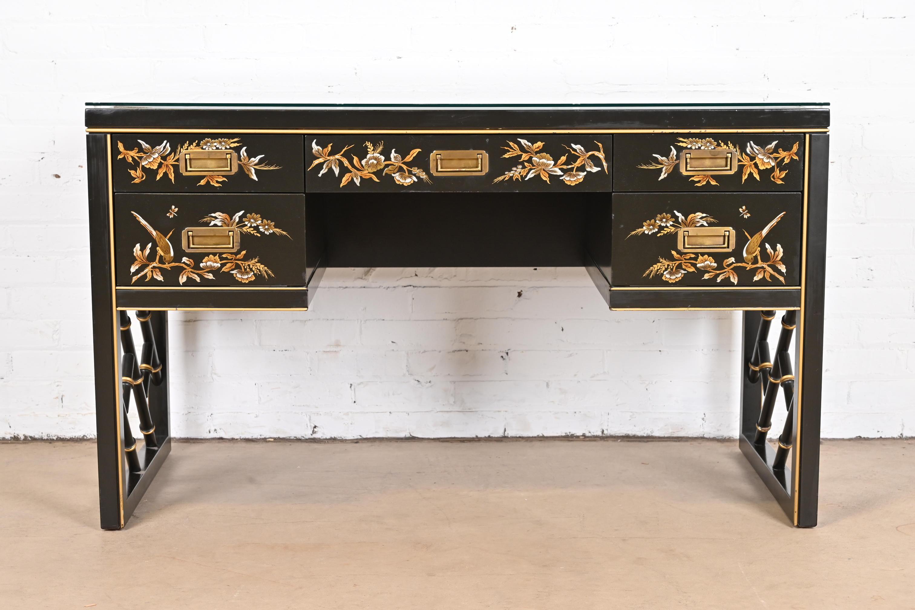A gorgeous Chinoiserie Hollywood Regency Campaign style writing desk

By Sligh Furniture

USA, Circa 1970s

Black lacquered walnut, with hand painted Asian nature scenes, faux bamboo, embossed leather top with custom glass, and original brass