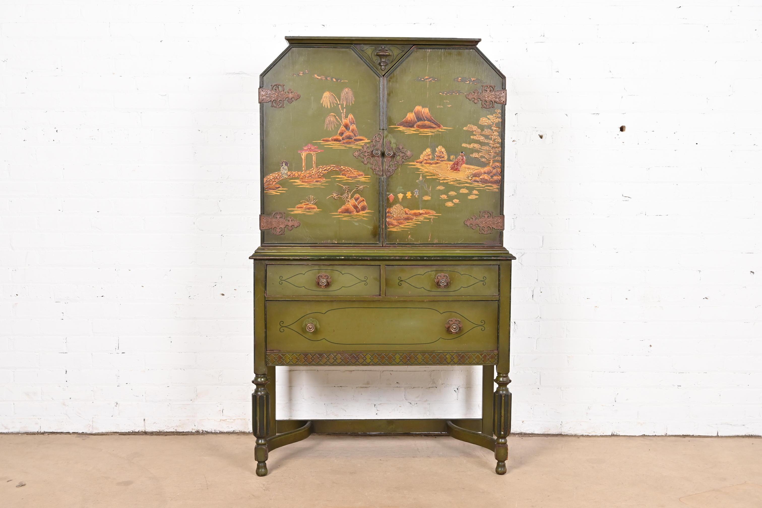 A gorgeous Chinoiserie Jacobean style bookcase, dining cabinet, or bar cabinet

In the manner of Berkey & Gay

USA, Circa 1920s

Green lacquered carved walnut, with hand painted Chinoiserie scenes, and original brass hardware. Shelves are