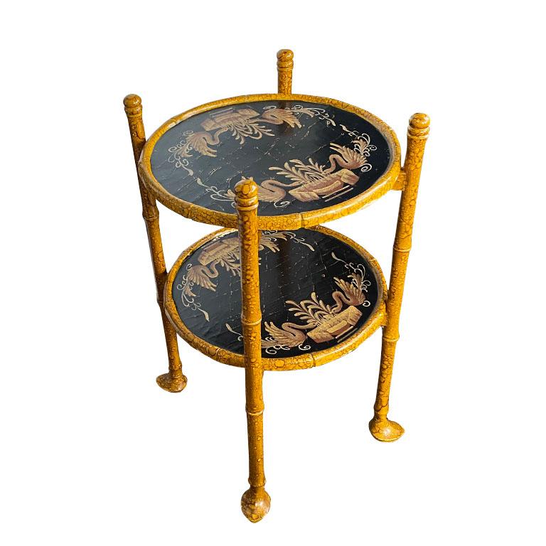 A fine English chinoiserie theme burnt bamboo side table or drink tray table. This piece is round and features two levels of trays, both of which are removable. The brown burnt bamboo base as well is foldable and easy to fold away if needed. Both of