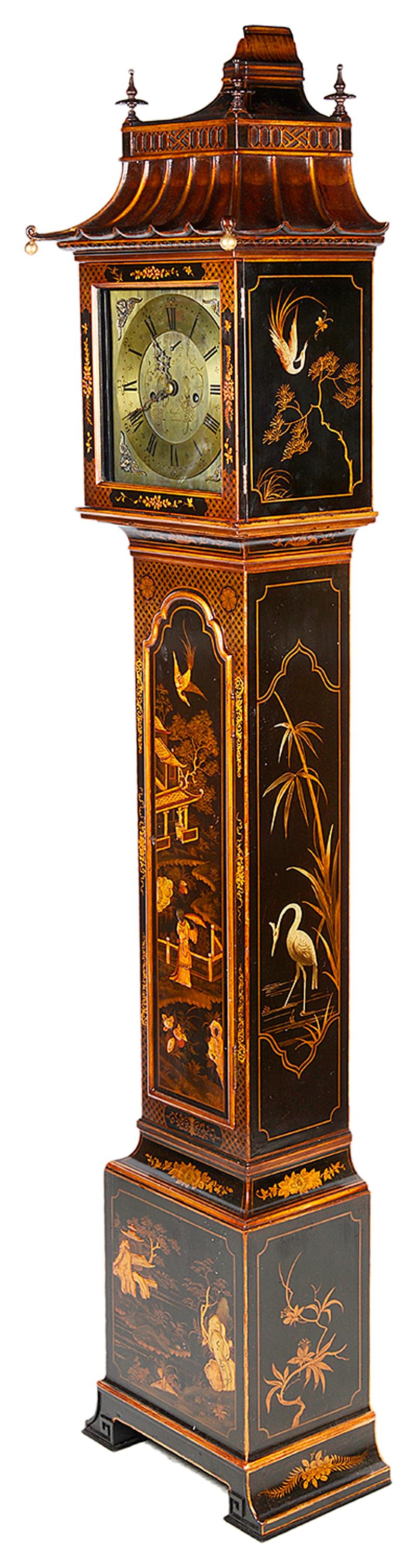 A good quality Chinese Chippendale style chinoiserie lacquer grandmother clock. Having a pagoda style hood, brass faced, eight-day movement. The case having gilded classical oriental scenes.
Retailers; Maples, London.