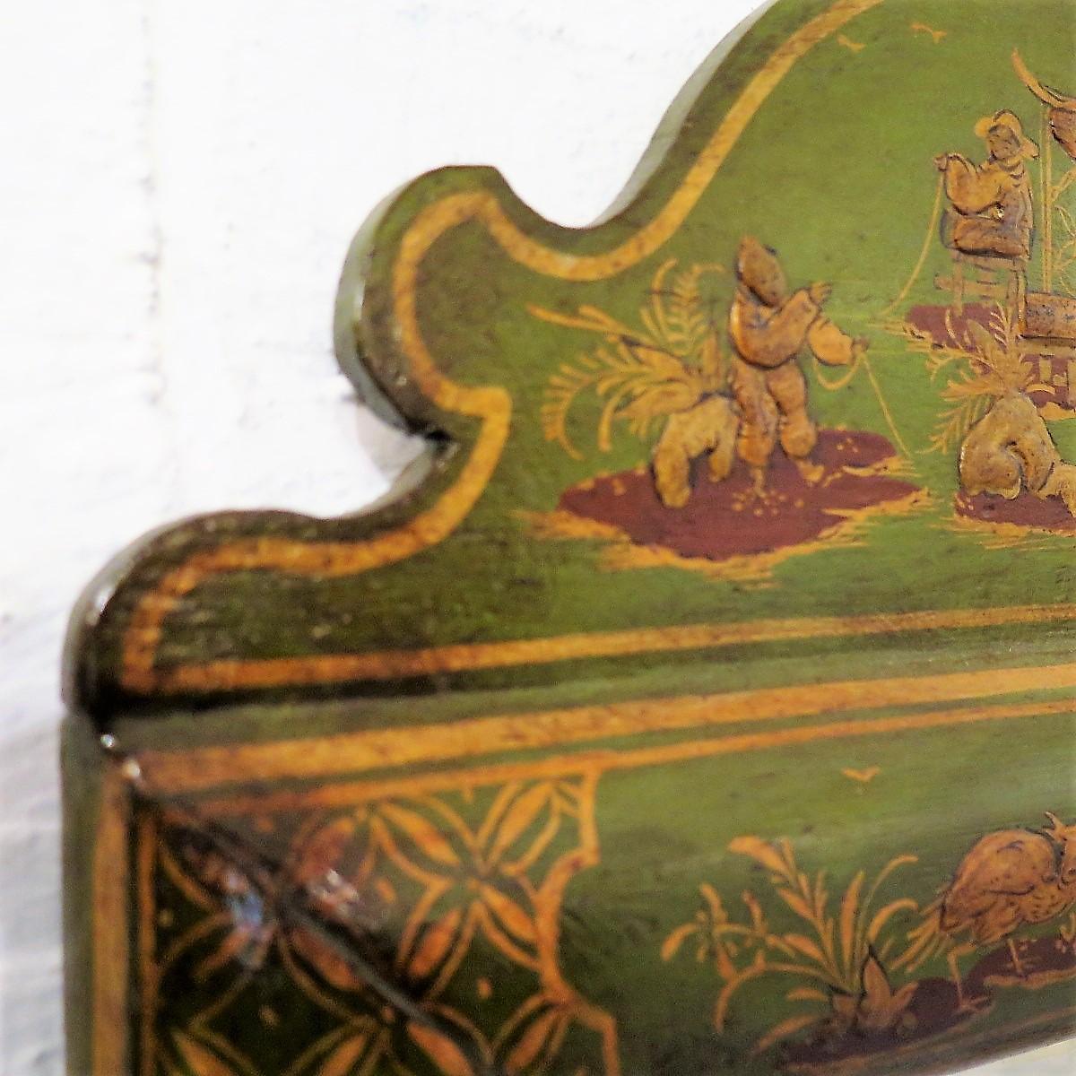 A chinoiserie lacquer cushion mirror of convenient size, restored in green lacquer, the highly polished frame retaining its very heavy plate glass.