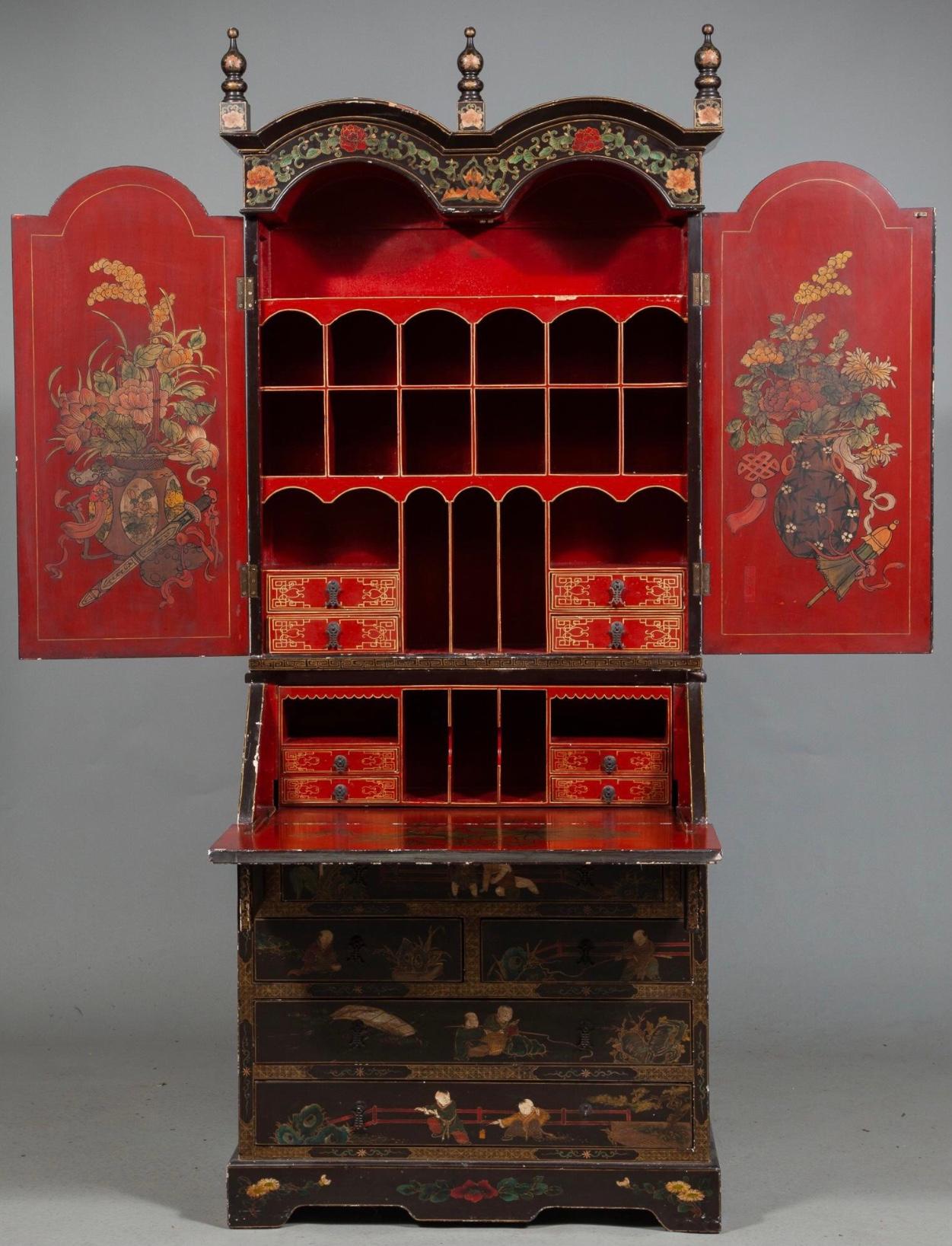 This chinoiserie faux coromandel secretary with it’s intricate japanning. The upper portion is full of drawers and cubby holes, with a fold down writing surface. The bottom section large drawers for ample storage.