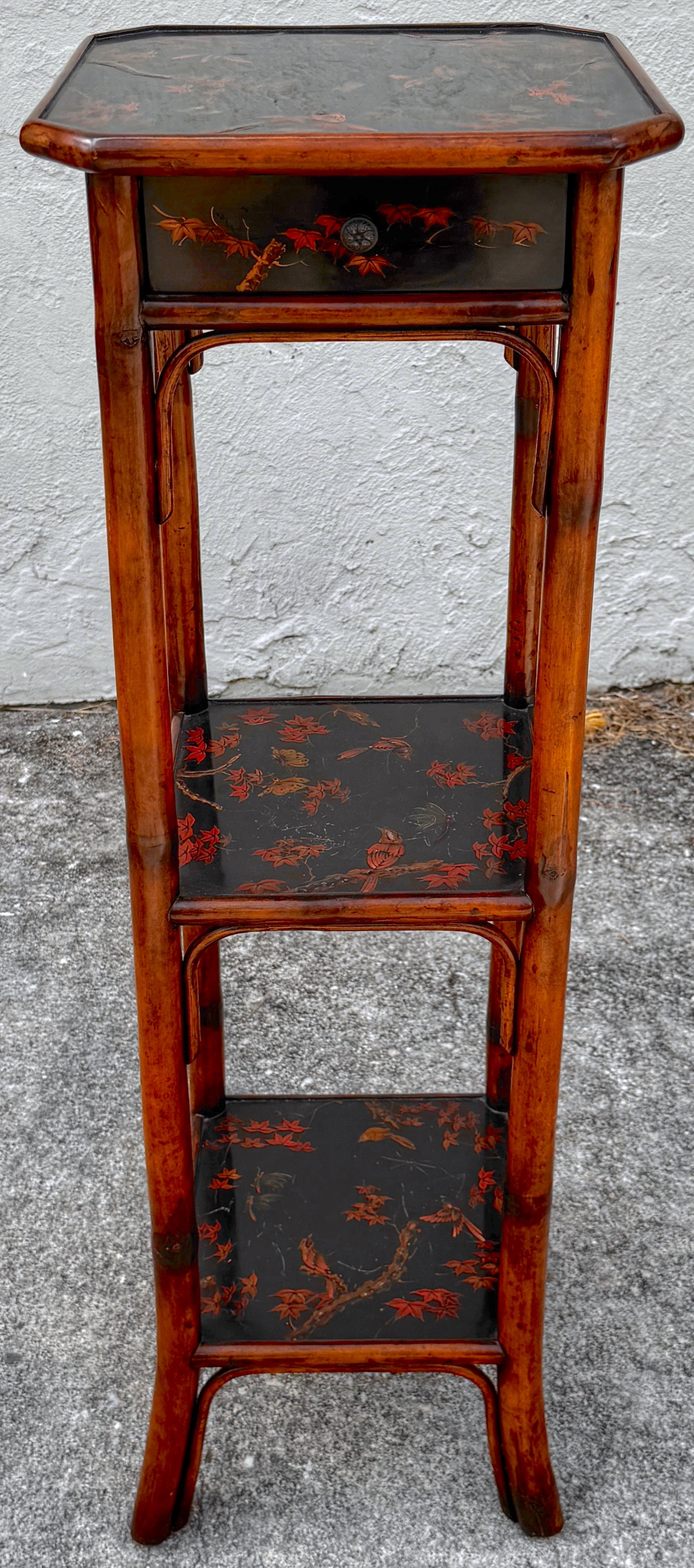 Chinoiserie Lacquered Bamboo 3-Tier Pedestal with Drawer

Attributed to the workshop of Theodore Alexander

This exquisite Chinoiserie lacquered bamboo pedestal is a beautifully made piece, attributed to the esteemed workshop of Theodore Alexander.
