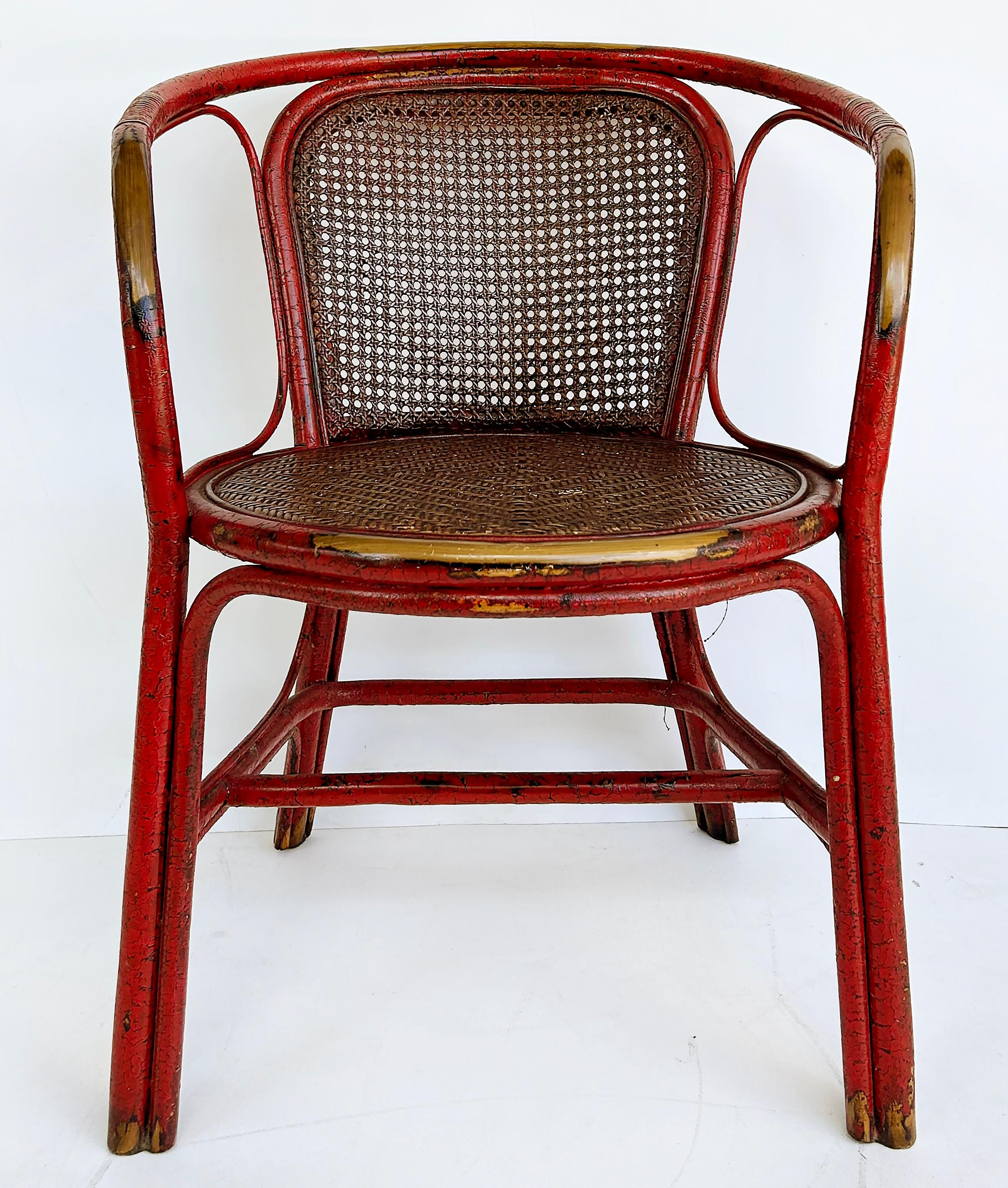Chinoiserie Lacquered Bentwood, Cane, Accent Armchair with a Woven Grass Seat

Offered for sale is a chinoiserie style lacquered bentwood, rattan, cane accent armchair with a woven grass seat. There is a lovely wear pattern to the red lacquered