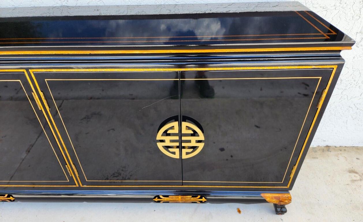 For FULL item description click on CONTINUE READING at the bottom of this page.

Offering One Of Our Recent Palm Beach Estate Fine Furniture Acquisitions Of A
Vintage Chinoiserie Highly Polished Black Lacquered Buffet Sideboard with Carved Gilded