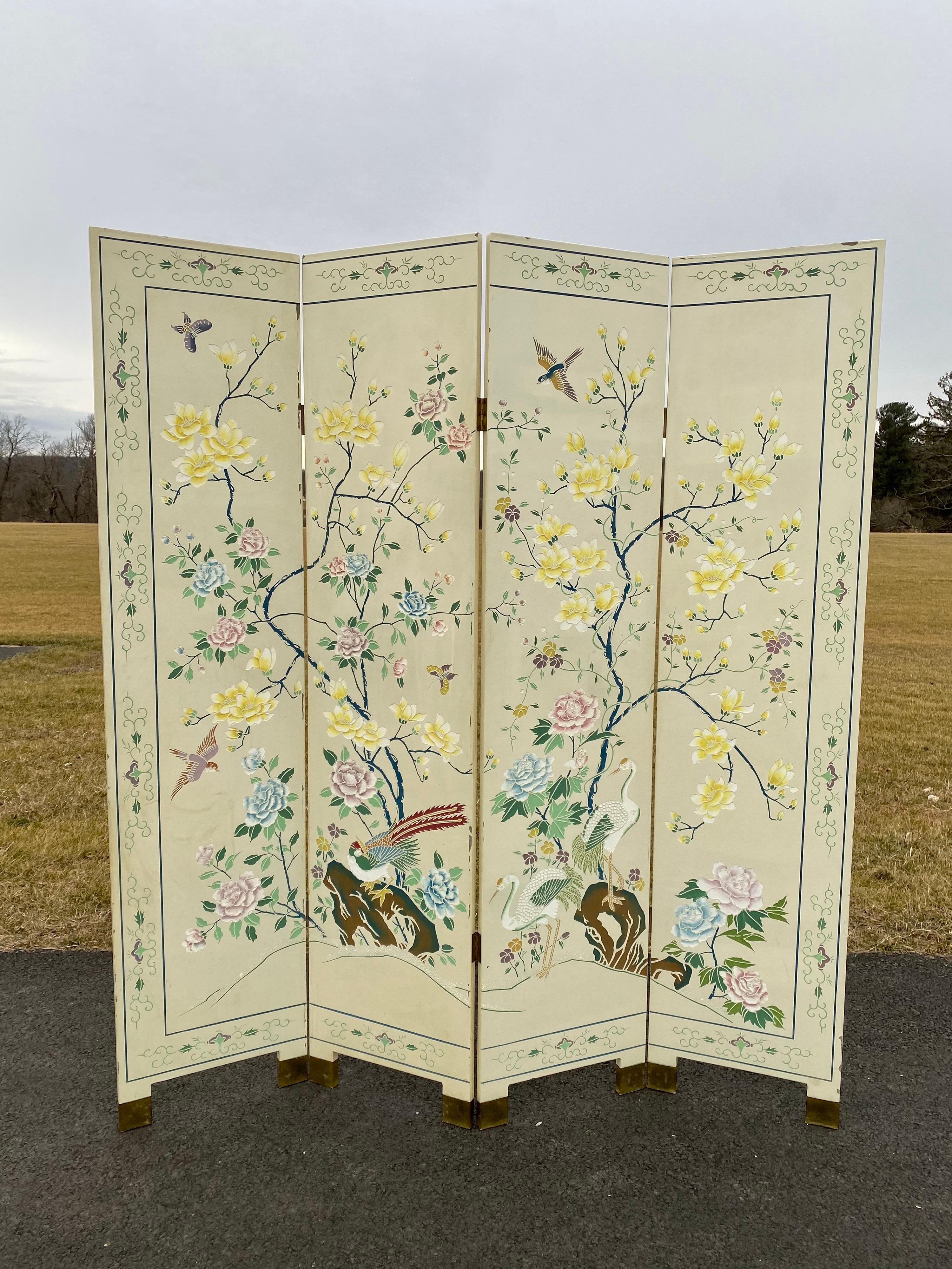 Beautiful chinoiserie tree of life spring or summer floral and bird scene floor screen divider featuring double sided scenes. Four panels are joined by brass toned hardware and legs are capped in brass as well.

Each panel features highly detailed