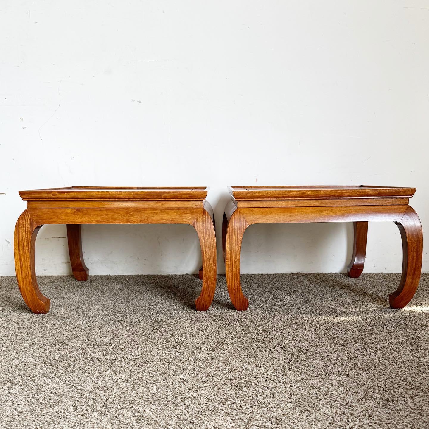 Discover the timeless elegance of a pair of Chinoiserie Ming Style Wooden Side Tables, reflecting an East meets West aesthetic with intricate Chinoiserie motifs, inspired by traditional Chinese Ming dynasty furniture. These tables add both