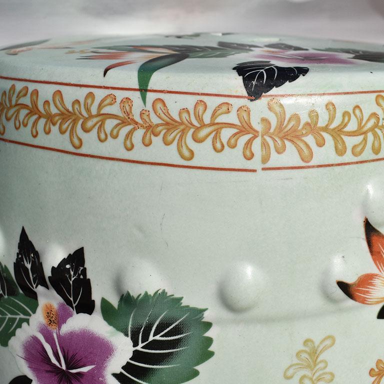 Mint green floral chinoiserie garden stool. A fantastic piece for a patio. Beautiful floral details are transferred onto a mint green background. Raised circular pattern around the base and top edge. Pierced Double Happiness design at top and sides.