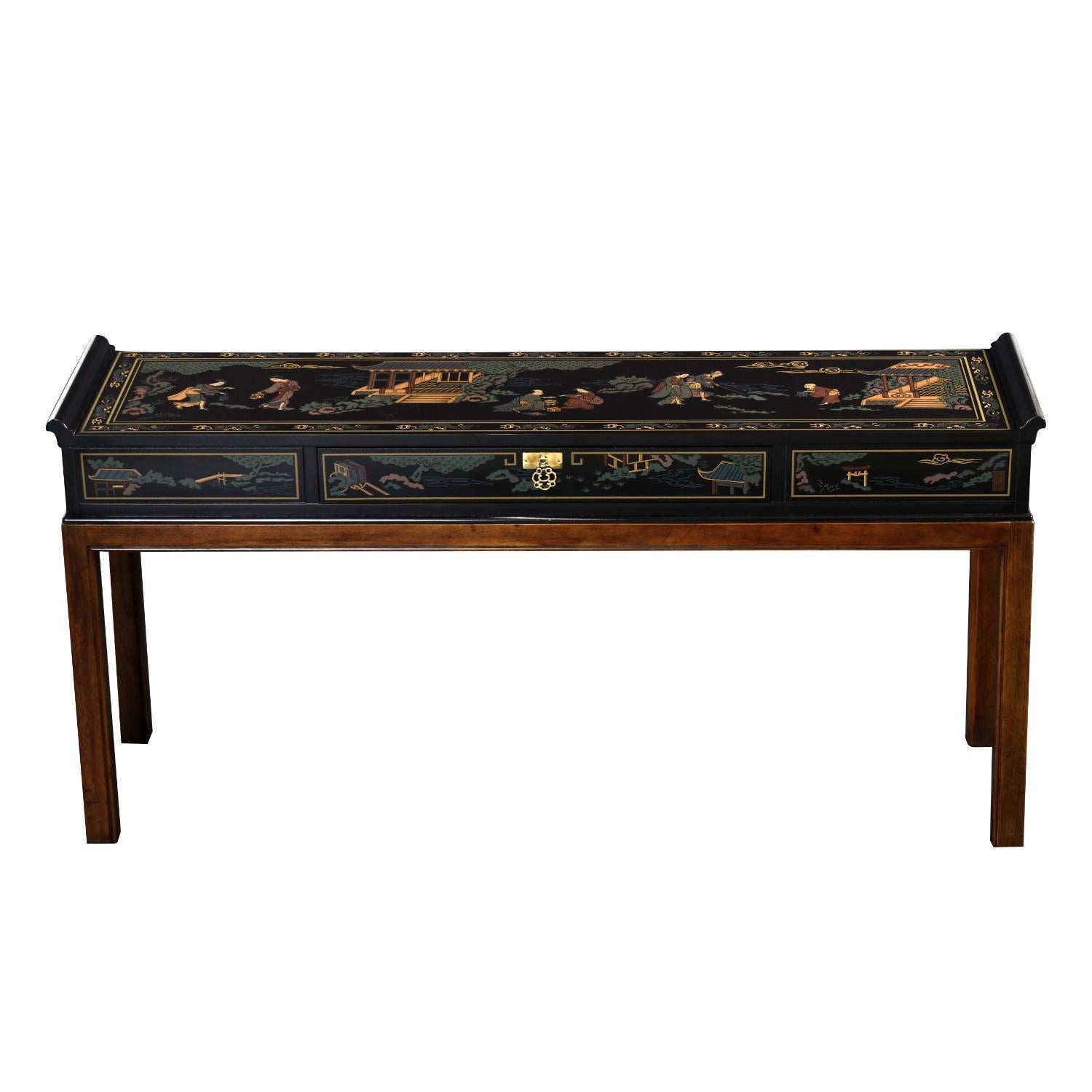 Exceptional Nineteen-Laties (late 20th Century) Chinoiserie console table by Drexel. Winged tips flanking the ends and the brass medallion drawer pull are classic Chinese elements along with the uniform silhouette. In the West we call it a Parsons