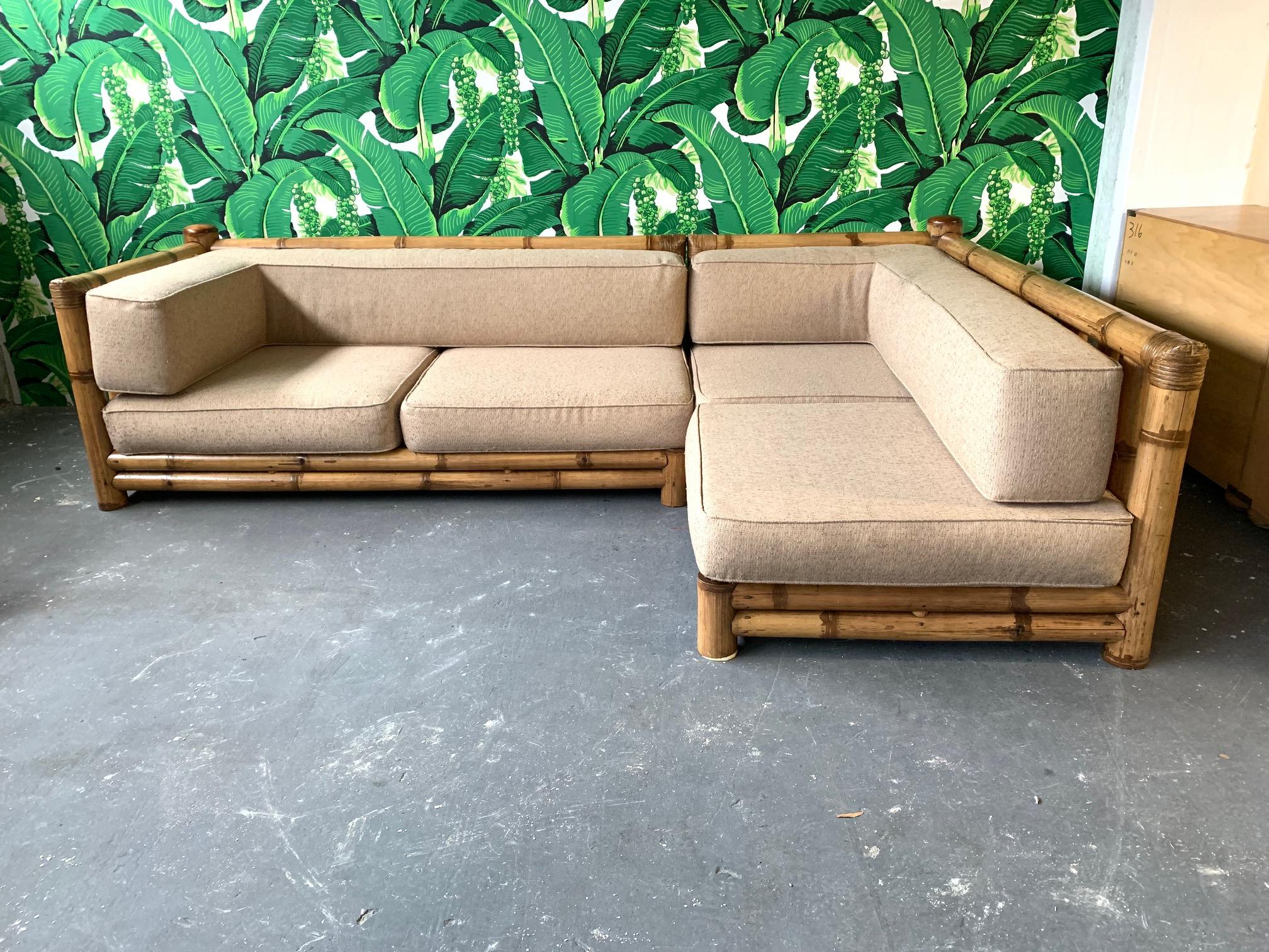 Vintage sectional sofa constructed from oversized bamboo features two separate sections and large, comfortable cushions. Very good condition with very minor signs of age appropriate wear.