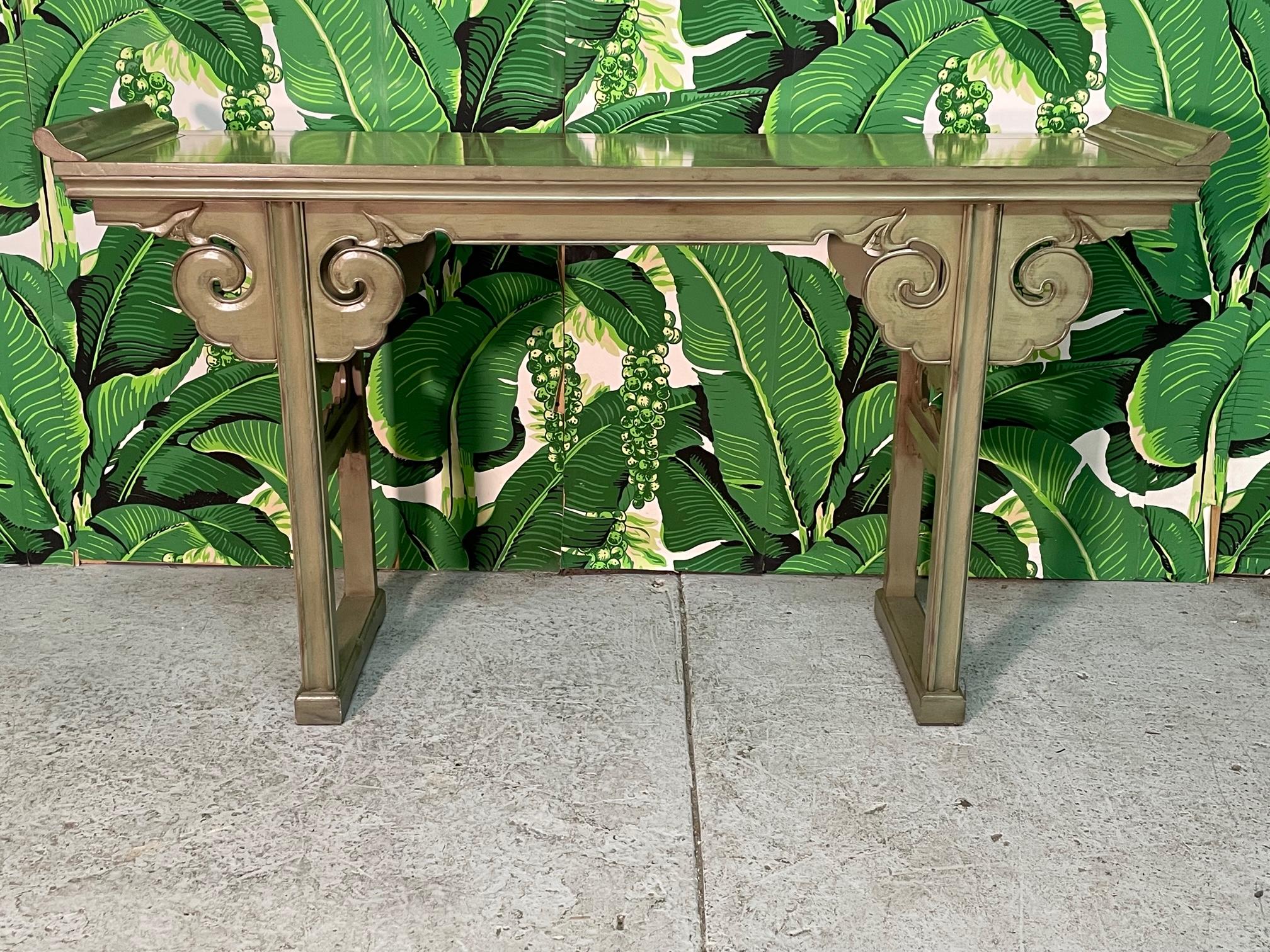 Vintage console or altar table features Asian chinoiserie styling with everted ends and hand carved apron and spandrels. Very good condition with minor imperfections consistent with age (see photos).
 
 