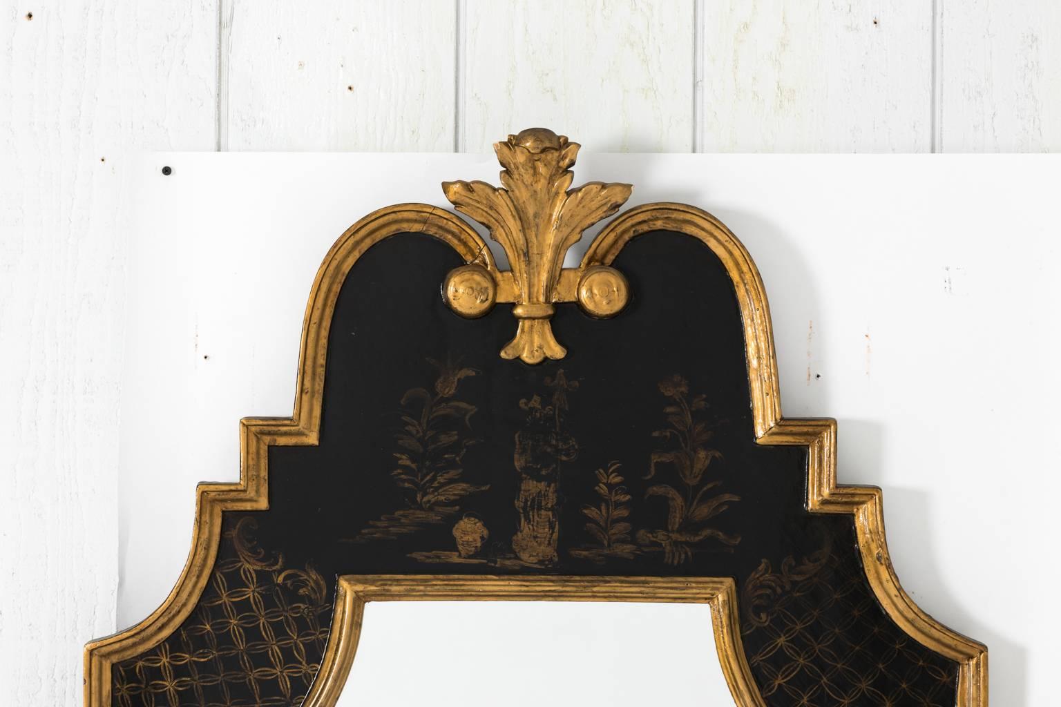 Black painted chinoiserie mirror with giltwood, circa early 20th century.
  