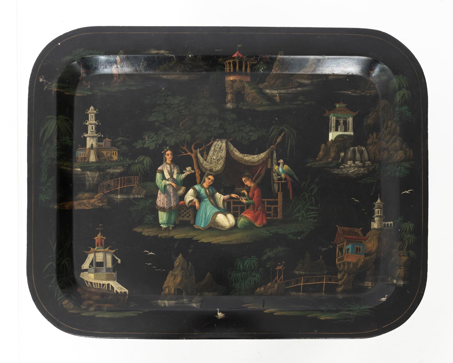 Regency era tin-tole painted serving tray with chinoiserie style landscape scenes on a faux-bamboo stand, circa 19th century.
 