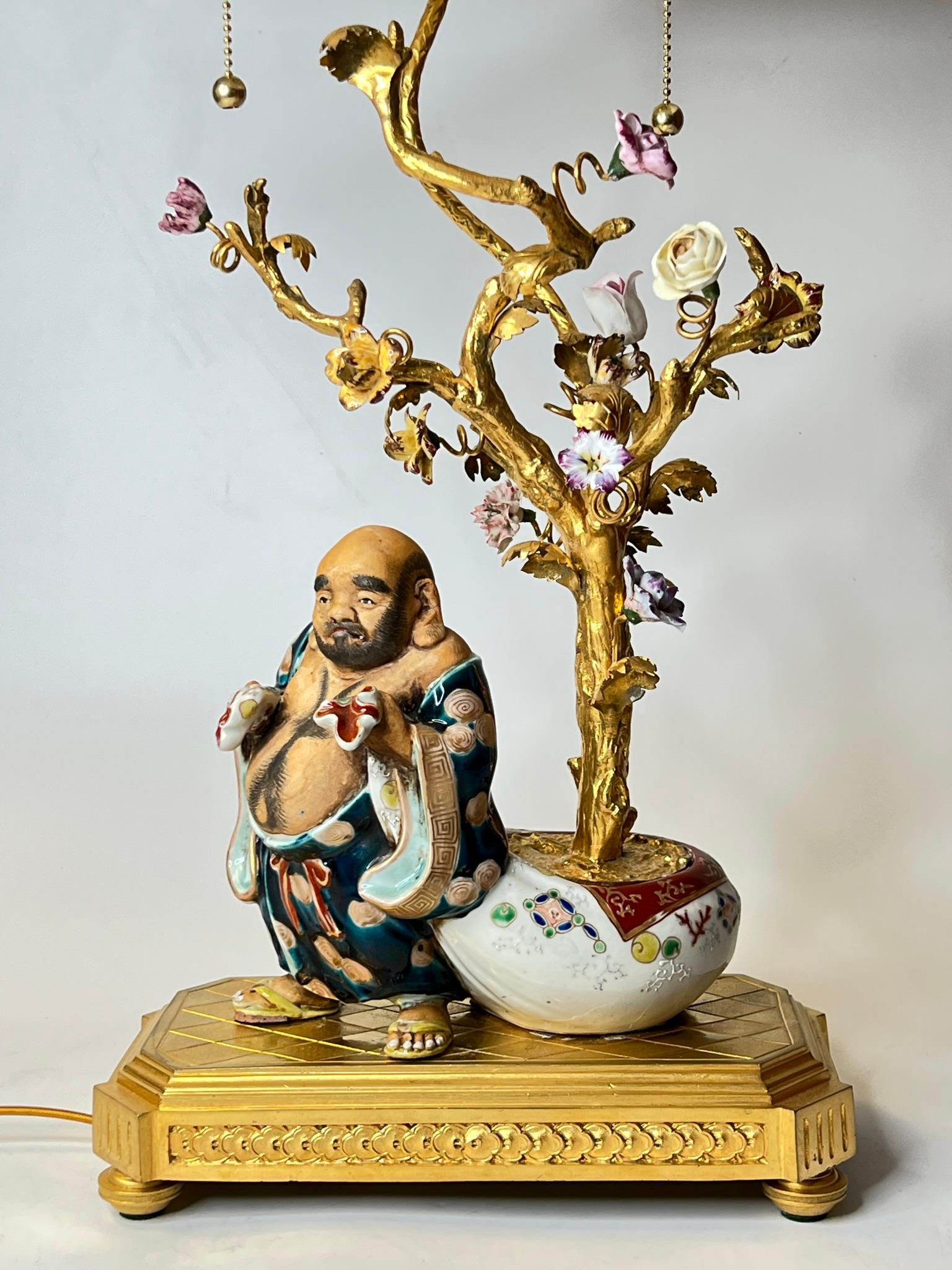 Chinese Export Chinoiserie Porcelain and Gilt Bronze Table Lamp Depicting Budai Laughing Buddha