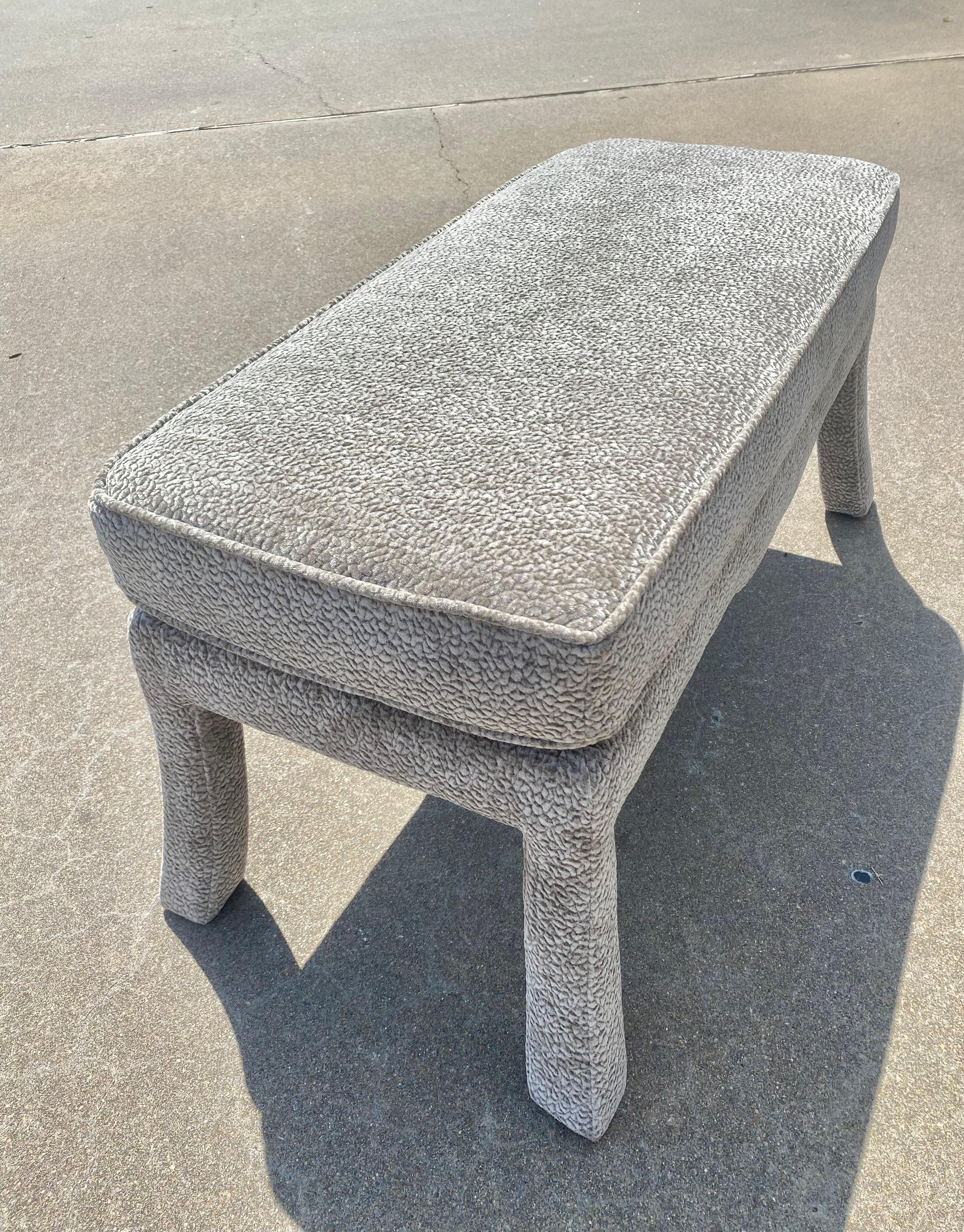 Newly upholstered in a soft, textured, dove gray textile by Kravet from the“Barton Chenille” line. We adore this Parsons style bench with the perfect splayed leg design and pillow top upholstery. 

41.88”W x 19.5”D x 20”H

A Chinoiserie piece from