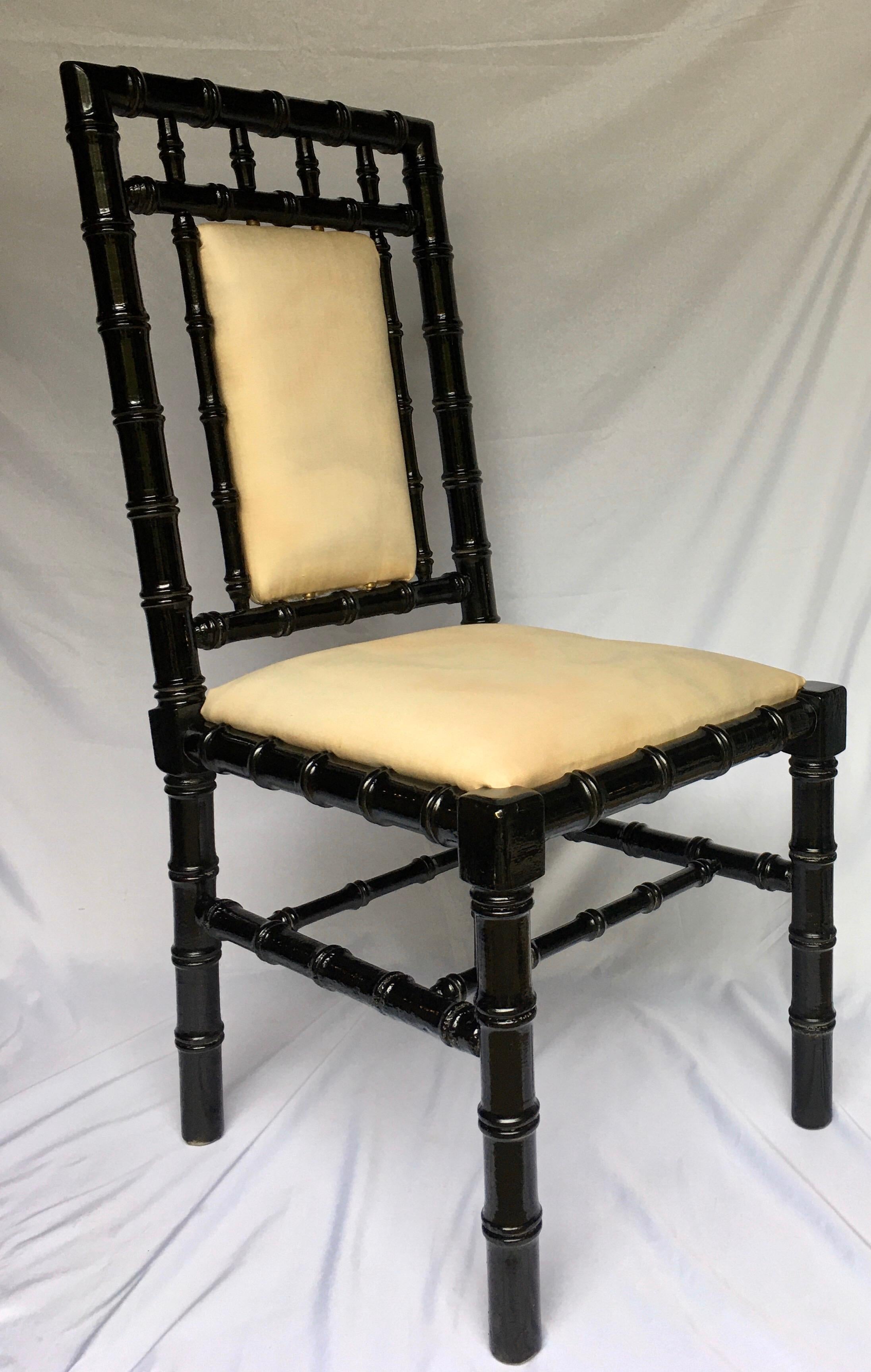 Chinoiserie style faux bamboo side accent chair with brass hardware. This Mid-Century Modern desk chair features a black gloss lacquered finish and original marbleized upholstery.