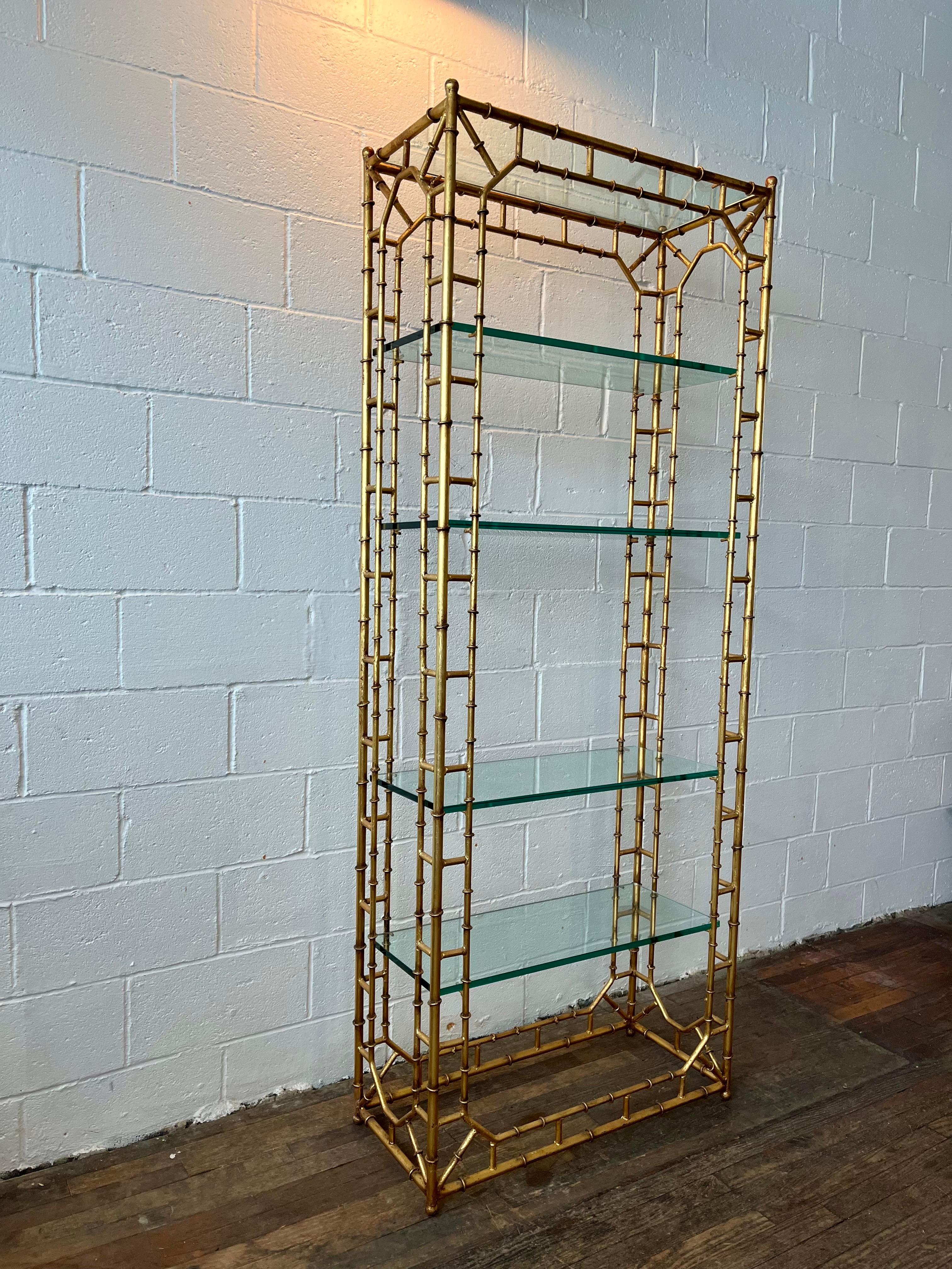 Elaborate faux bamboo gilt iron fretwork étagère having heavy gold finish, glamorous chinoiserie style and super heavy .5