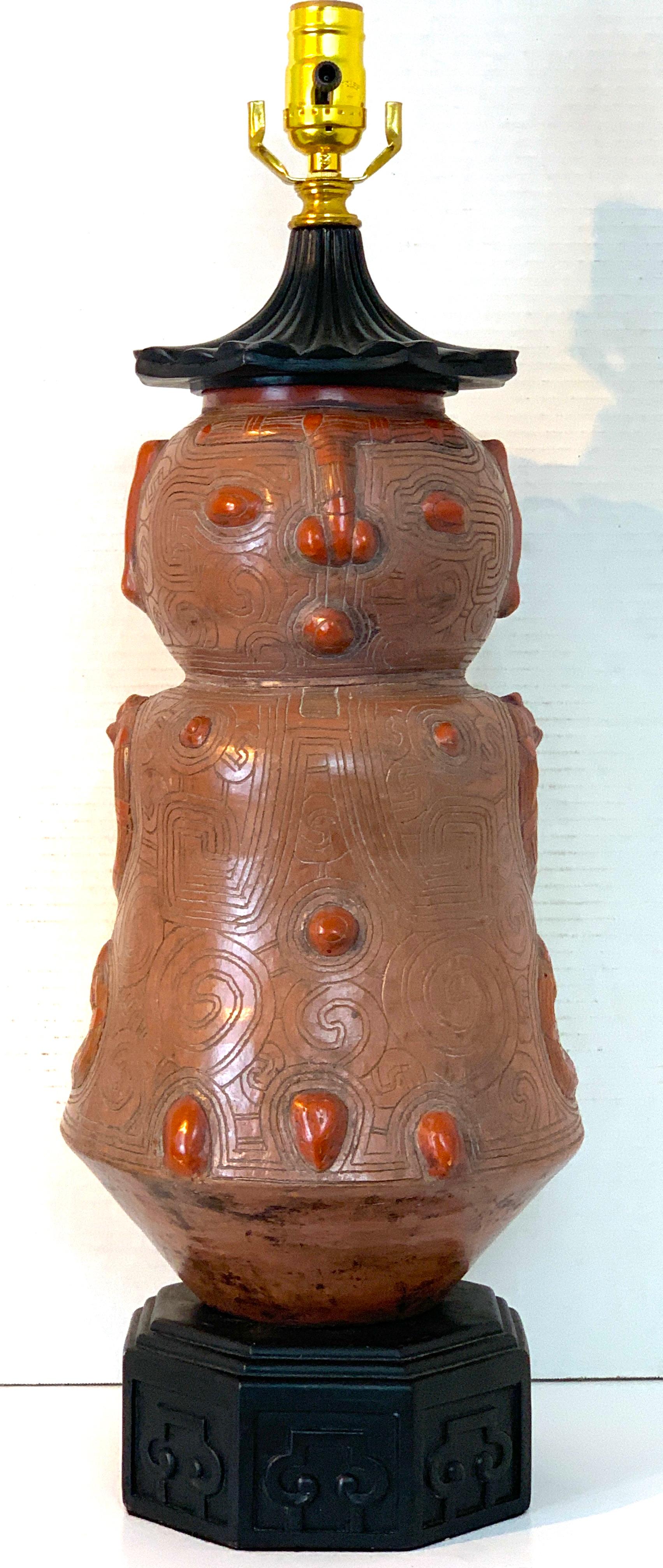 Chinoiserie Style Figural Pottery Attendant Lamp
1960s
Height: 26 in Width: 8 in Depth: 8 in

Revel in the exotic allure of this Chinoiserie style figural pottery attendant lamp. A fascinating embodiment of the Chinese Export style, this lamp