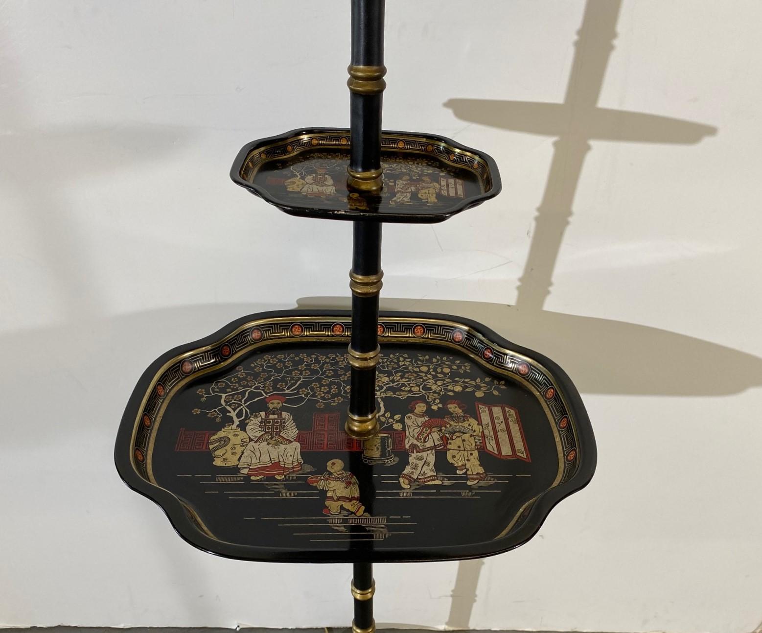 Chinoiserie style floor lamp. Two-tier trays with faux-bamboo stand. 