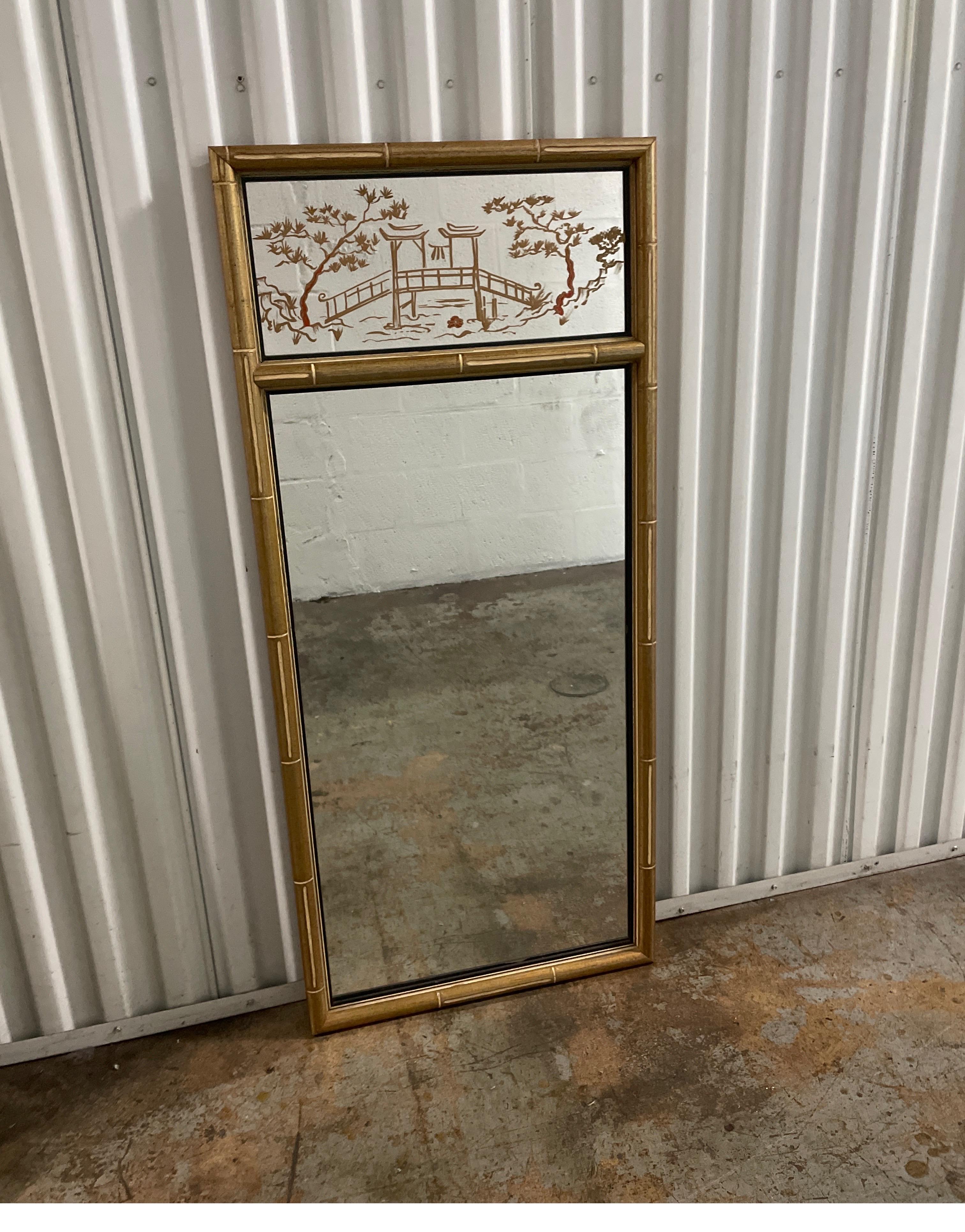 Gilded faux bamboo Chinoiserie style trumeau mirror.