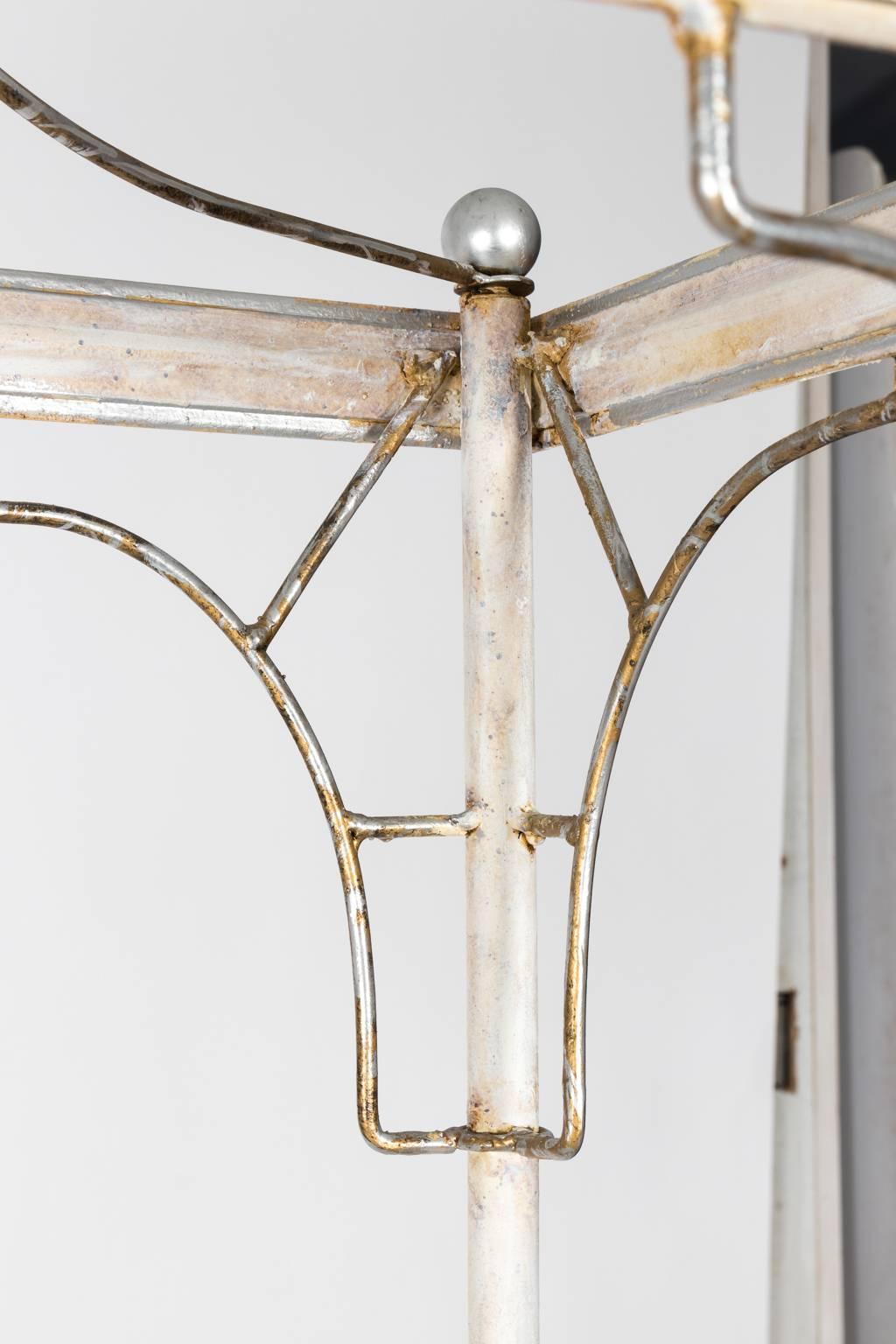 Chinoiserie style white painted metal faux bamboo étagère with four shelves, circa mid-20th century.