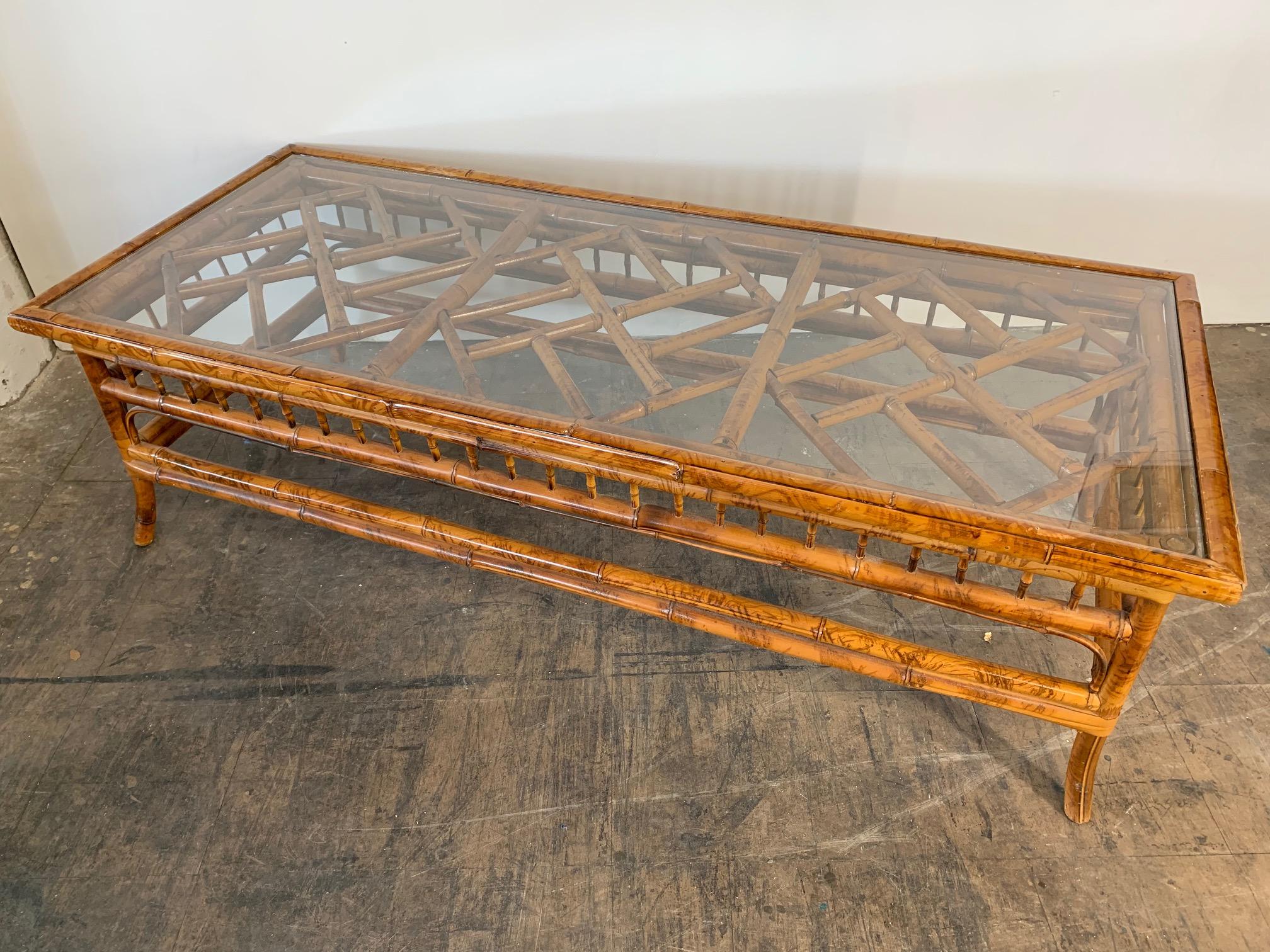 Asian chinoiserie style tiger bamboo coffee table with glass top. Very good vintage condition.