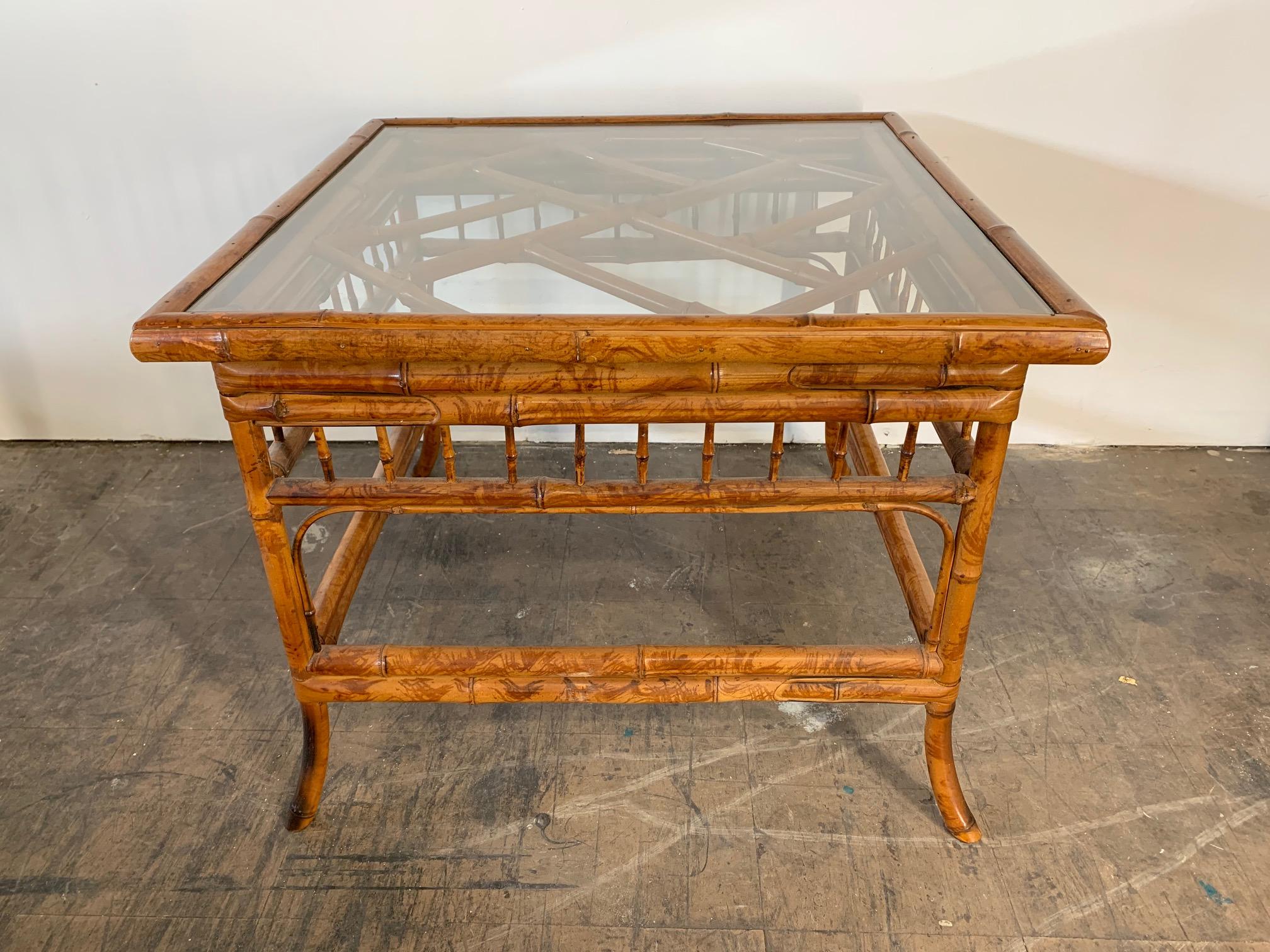 Asian chinoiserie style tiger bamboo side table with glass top. Excellent vintage condition.