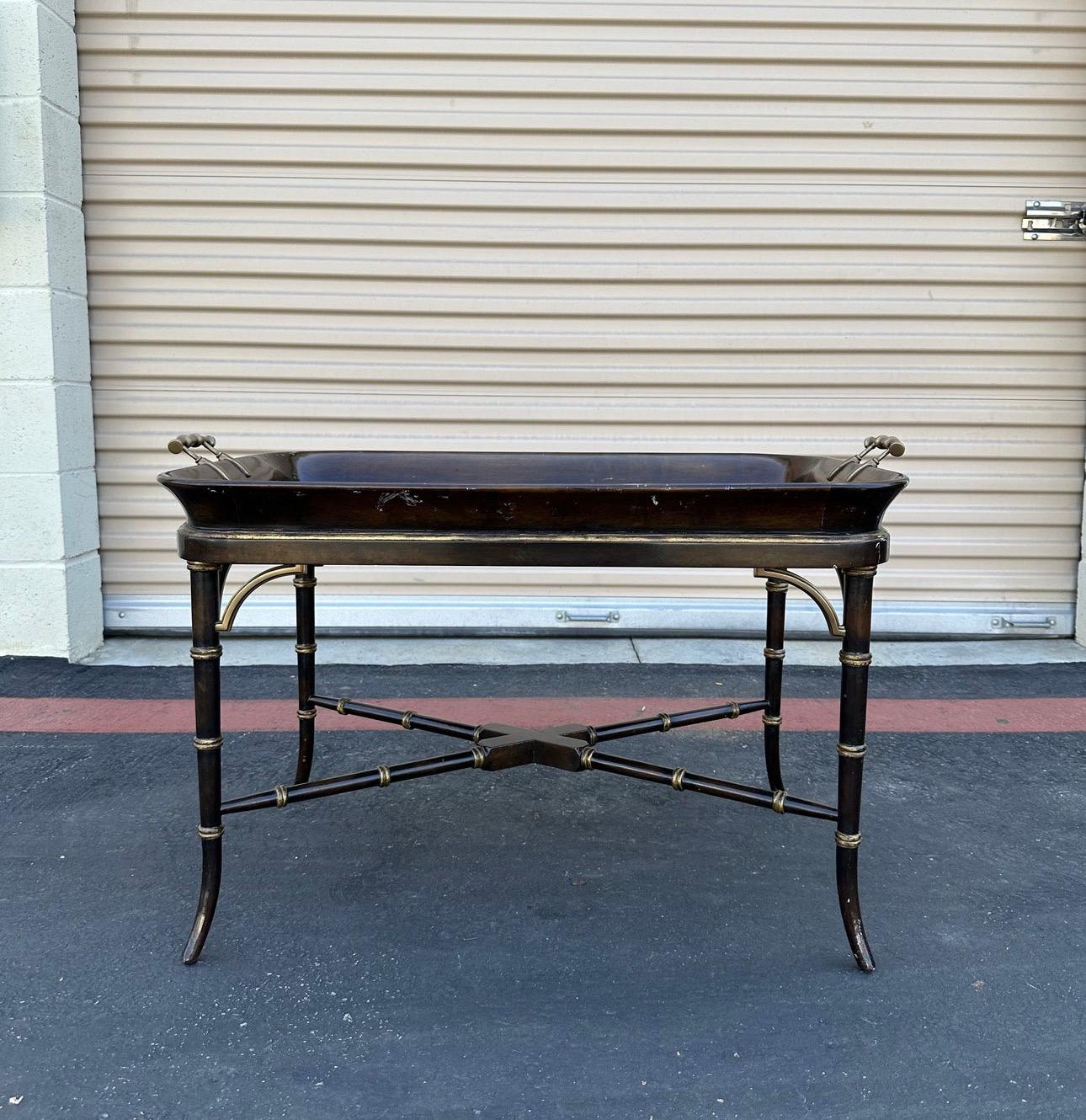 Amazing Chinoiserie Tray Top Coffee Table by Theodore Alexander. It has the label in the bottom. Painted and gilt imbuya tray table. Dish tray top and brass hardware
Beautiful turned bamboo style legs and gold gilt details. In really good condition.