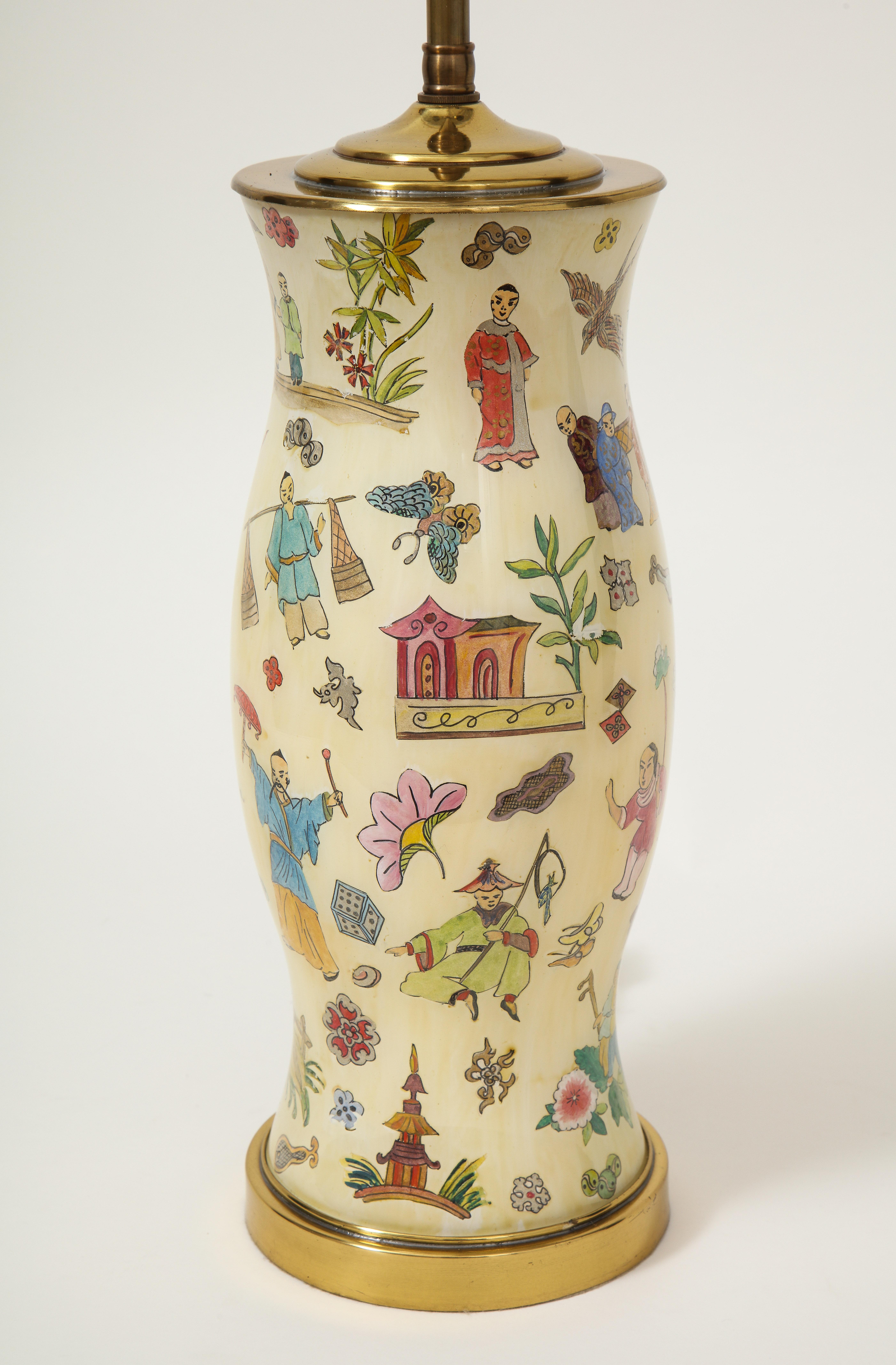 Reverse painted glass baluster-shaped vase decorated with various chinoiserie motifs including Mandarin figures, pagodas, lotus blossoms, yin yang emblems, and more on a cream ground; mounted on a turned giltwood base and fitted an adjustable brass