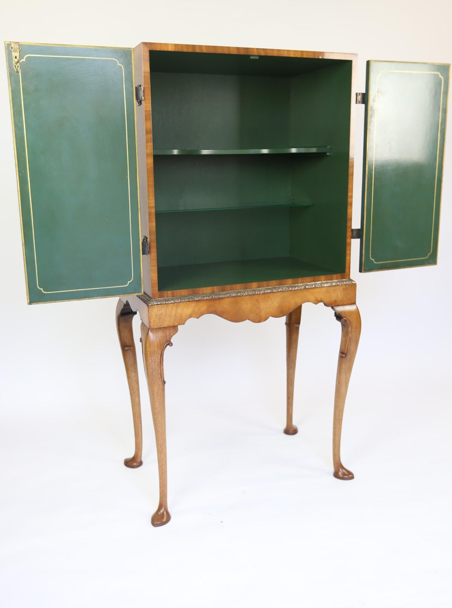 Chinoiserie & walnut Cocktail Cabinet on stand circa 1930s
Walnut cased  with pair Chinoiserie Decorated doors, 
Blue in colour Depicting River Scene with Boats ,Figures ,houses, Trees & Foliage
2pairs Brass Pierced Hinges, Brass Escutcheon with