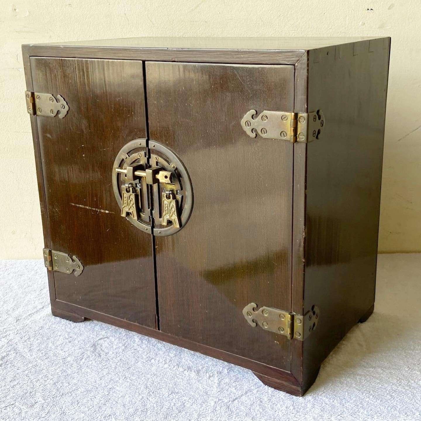 Exceptional vintage chinoiserie wooden jewelry chest. Features a green felt interior with brass accents and handles.
