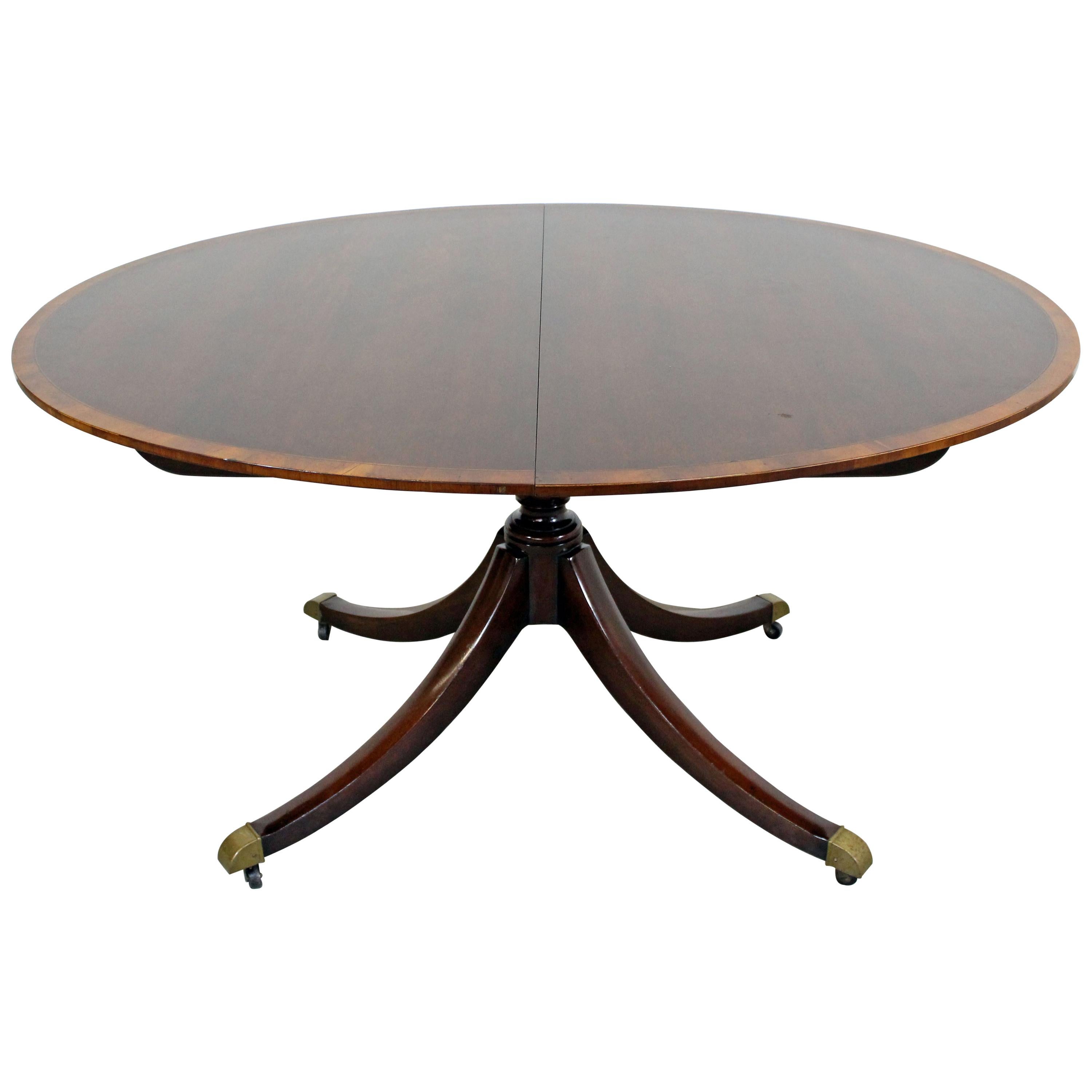 Baker Rosewood Round Extended Dining Table at 1stdibs