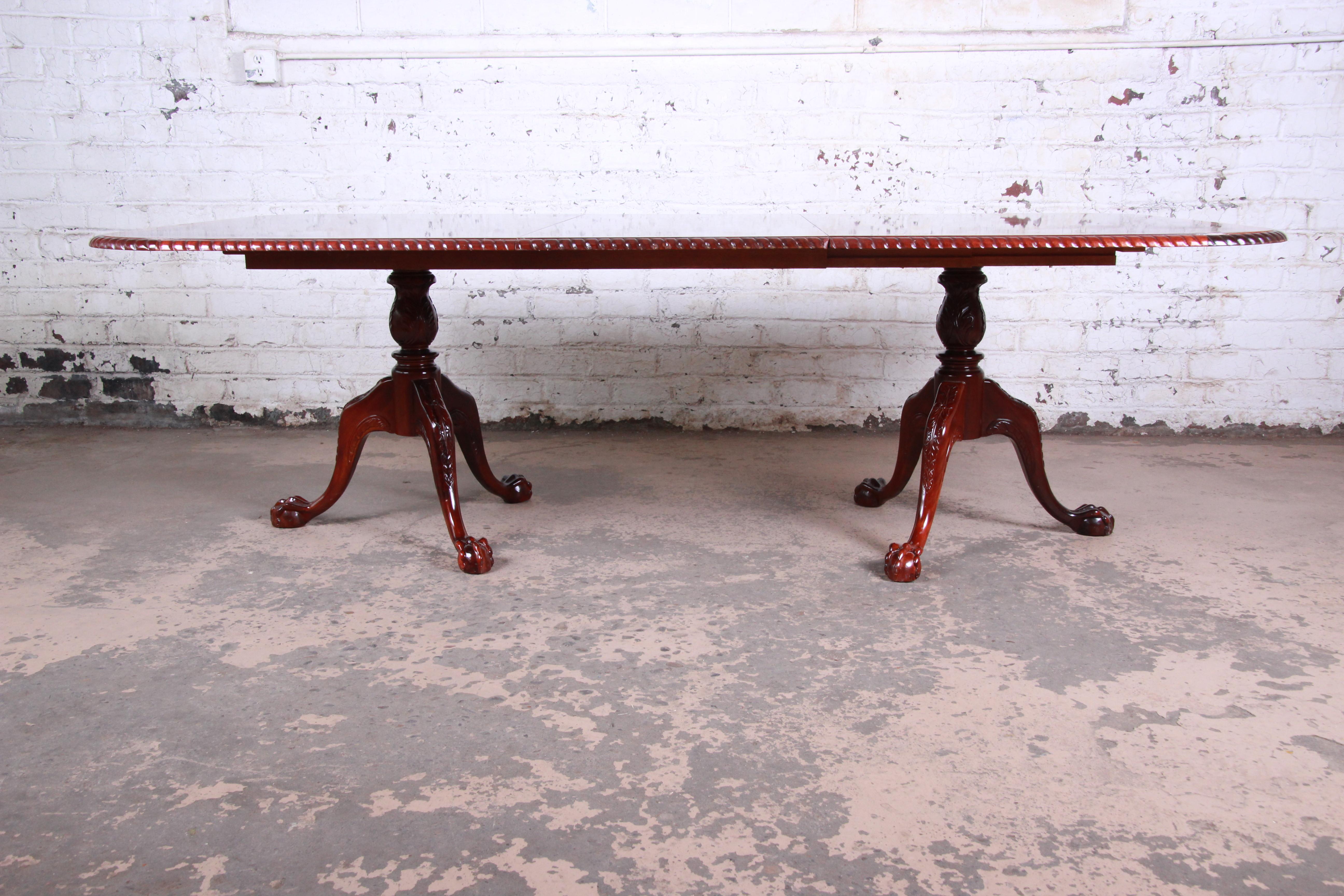 20th Century Chippendale Banded Mahogany Double Pedestal Dining Table with Eight Chairs