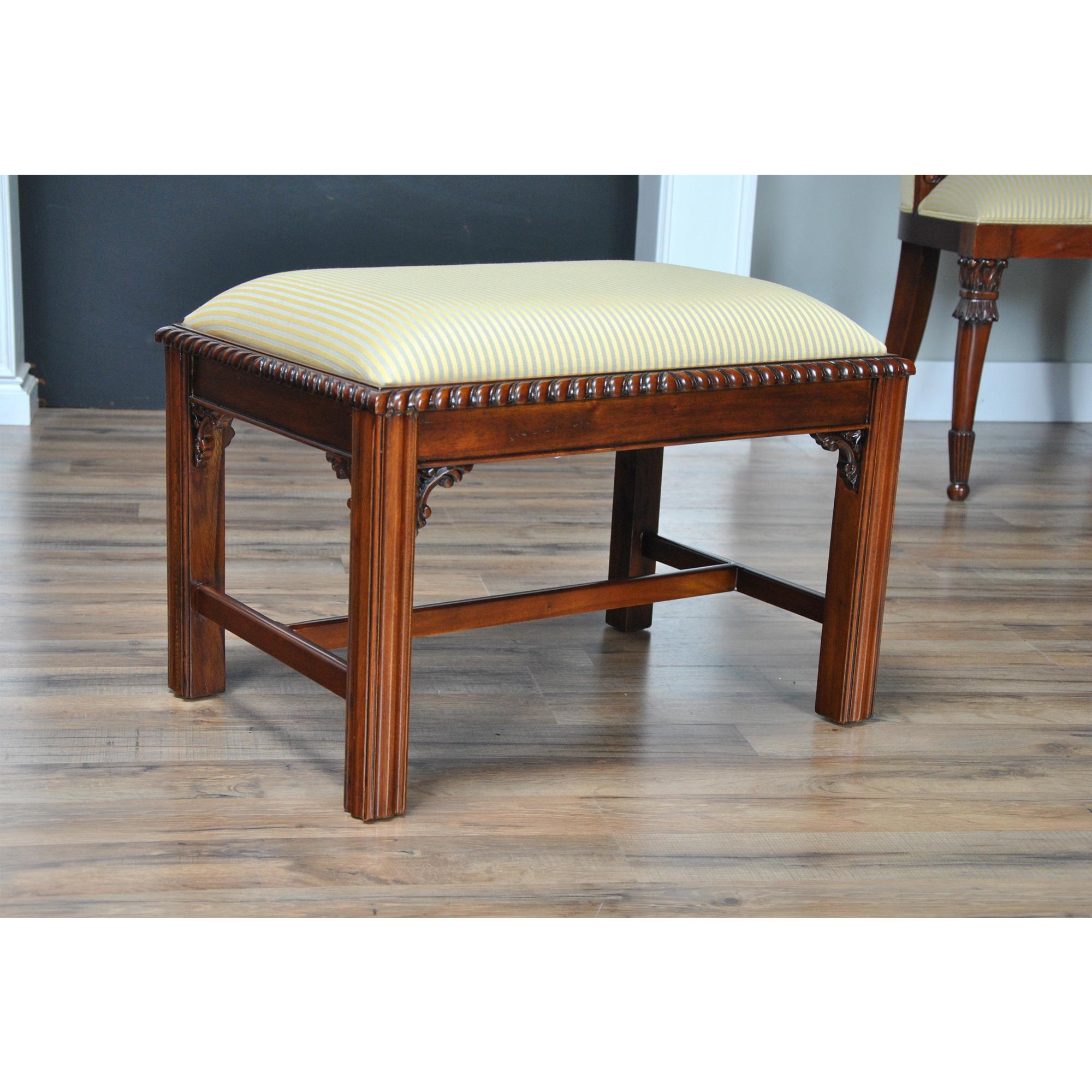 The Chippendale Bench with Cross Stretchers is a hand carved,  Chippendale style bench produced from solid, kiln dried, plantation grown, mahogany and features an upholstered slip seat on incised legs which are fitted with cross stretchers for extra