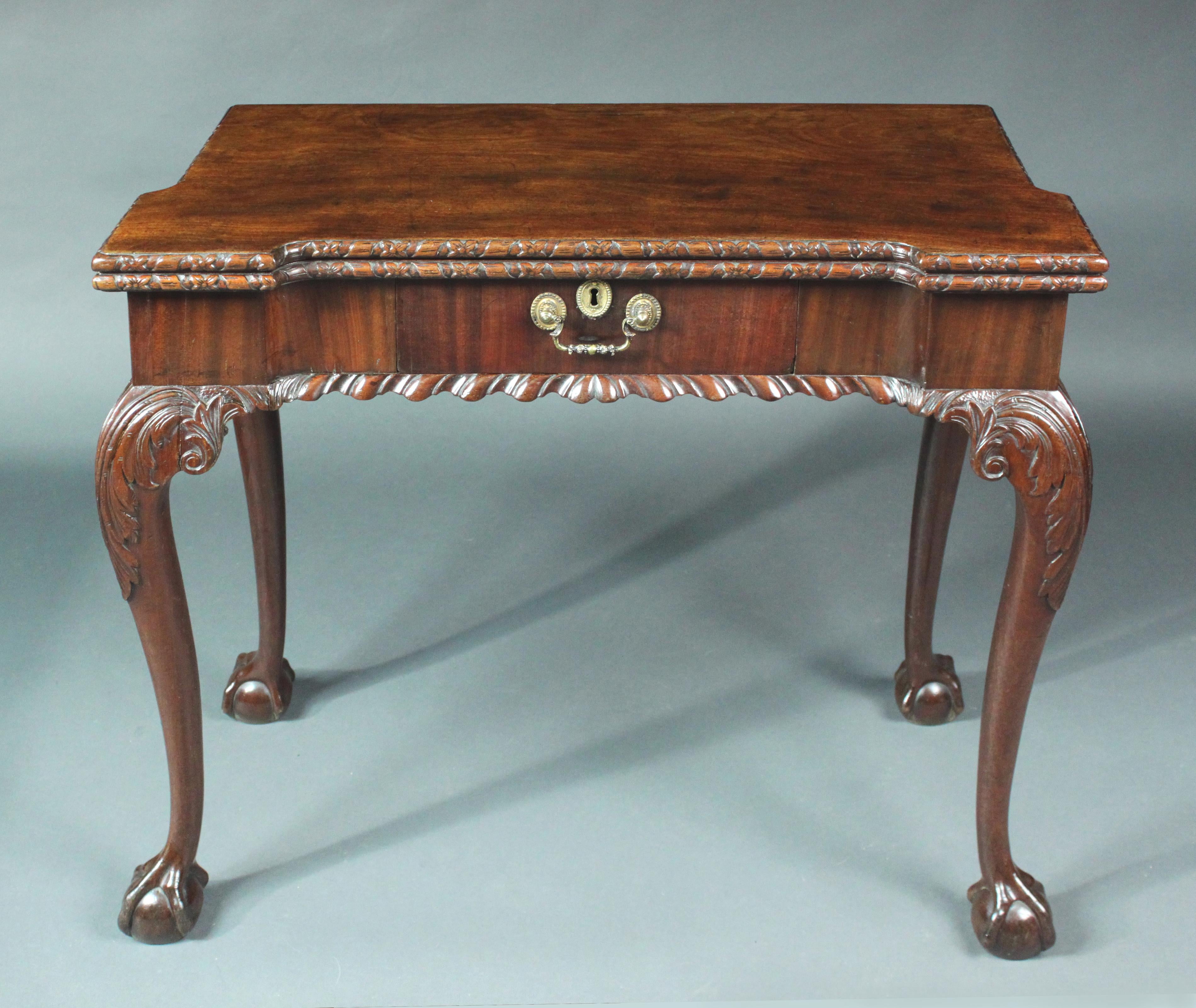 A George III mahogany cabriole leg card table with exceptional carved detail and rare small size. Secret compartment in the drawer and good original color and patina.
We will be fitting dark green baize.