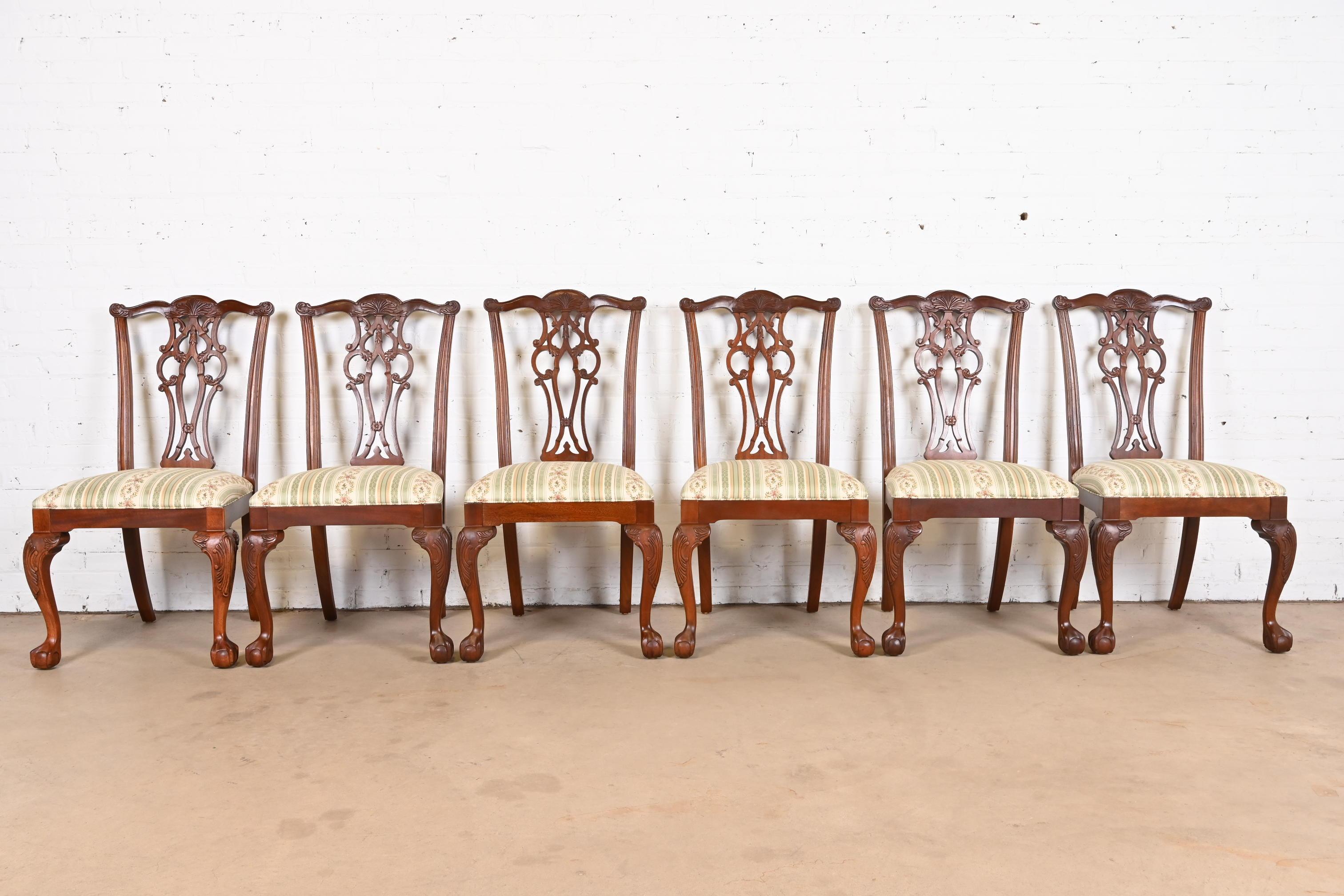 A gorgeous set of six Georgian or Chippendale style dining chairs

USA, Circa Late 20th Century

Carved mahogany, with upholstered seats.

Measures: 22