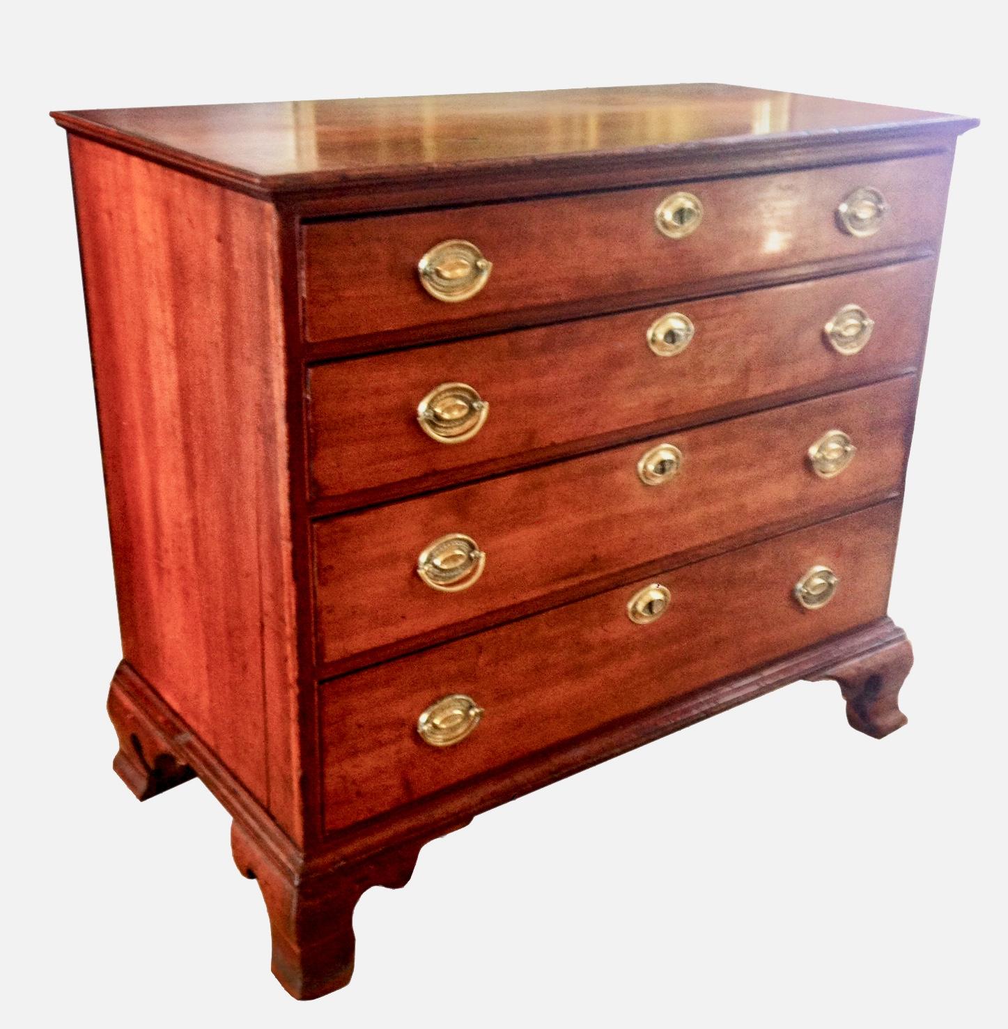 Rare Chippendale period cherrywood commode with four graduated drawers and exquisite original ogee bracket feet, original brass pulls, Circa 1780.
