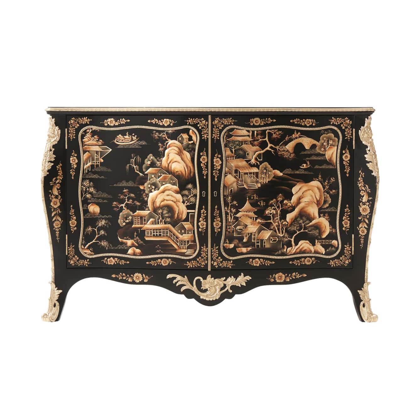 An exceptional black chinoiserie lacquered serpentine commode, the richly hand-painted top of chinoiserie landscapes and floral details above a cast brass floral decorated edge and two finely cast brass molding paneled doors enclosing a burgundy