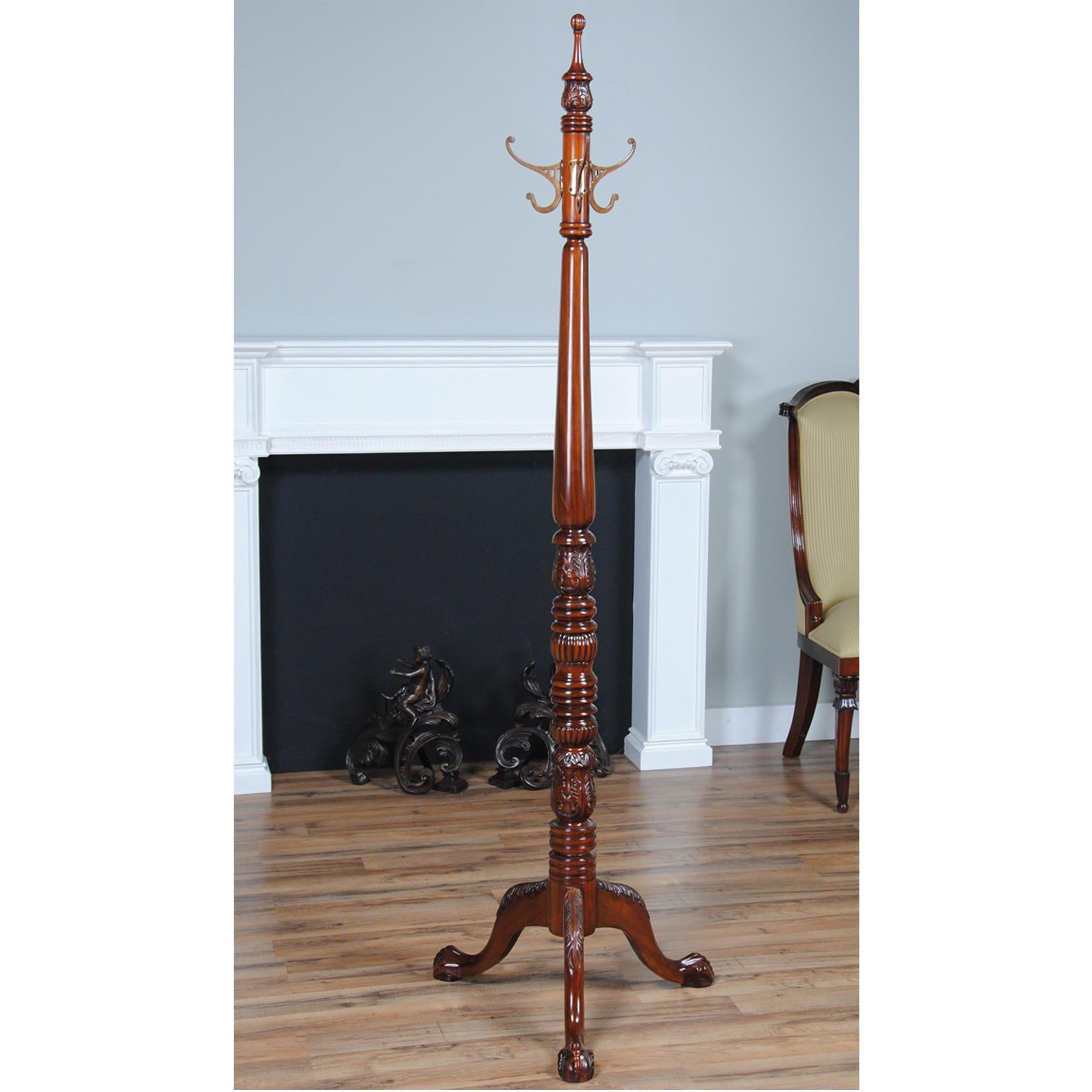 A solid mahogany Chippendale Coat Tree with Ball and Claw feet. The solid mahogany construction features hand carved details throughout. The mahogany is harvested from plantation grown, sustainably harvested trees and the carvings are executed by
