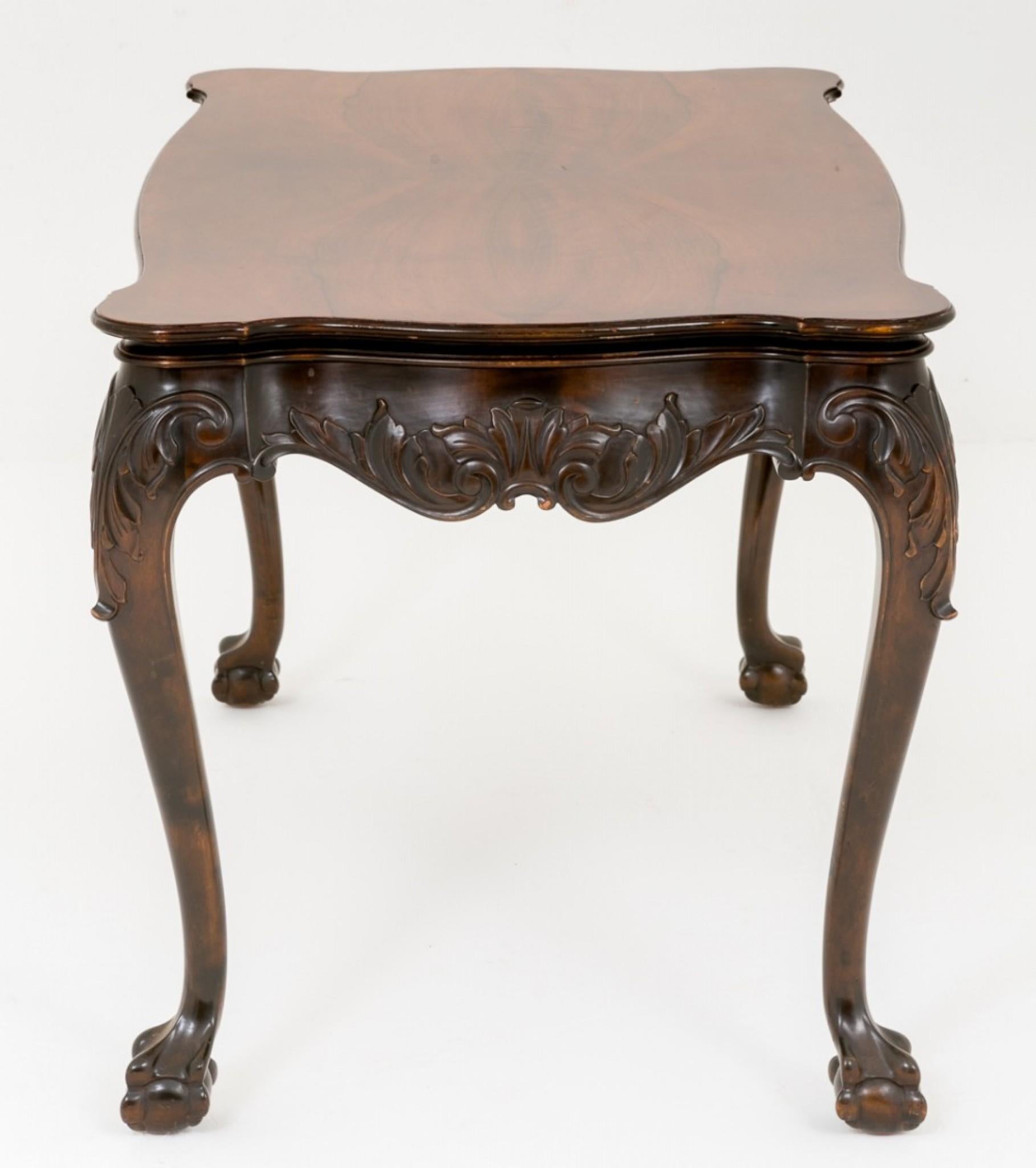 Pretty Mahogany Coffee Table in the Chippendale Style.
circa 1900
Standing on typical Chippendale style legs with boldly carved Ball and Claw feet.
The shaped frieze and knee featuring carved decoration.
The top of the table being highly figured.