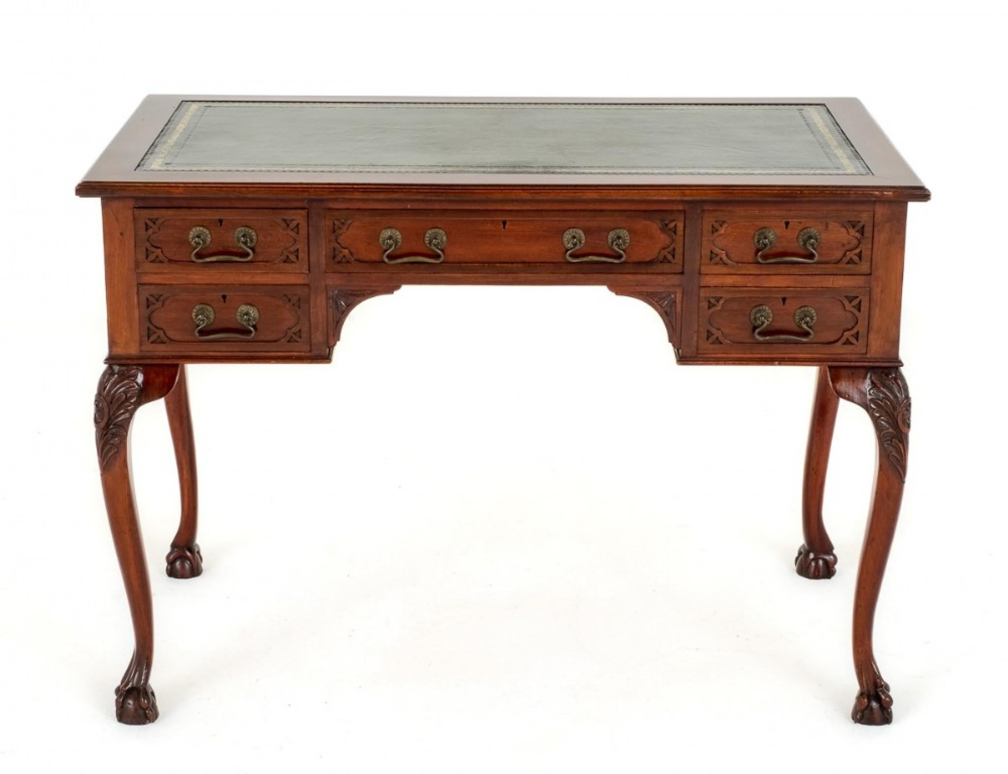 5 Drawer Mahogany Chippendale Style Writing Table.
Circa 1900
This Writing Table Features 5 Mahogany Lined drawers.
The Drawer Fronts Having Blind Fret Work to the Corners and Retain their Original Brass Swan Neck Handles.
The Writing Table is