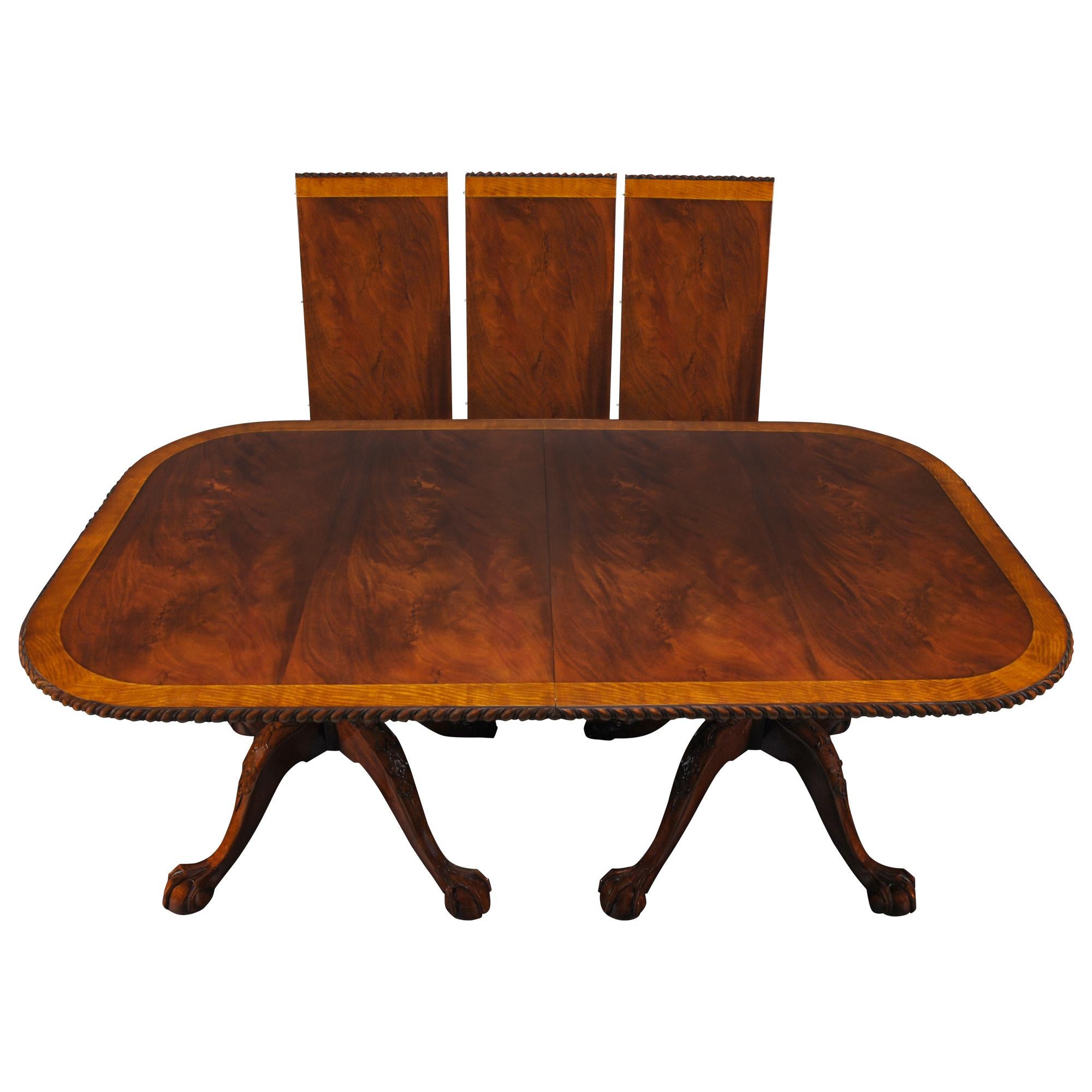 This is the version of the traditional Ball and Claw Chippendale Dining Table. It is a Chippendale inspired dining table featuring all of the finest elements of eighteenth century design including satinwood banding, fine quality mahogany veneers on