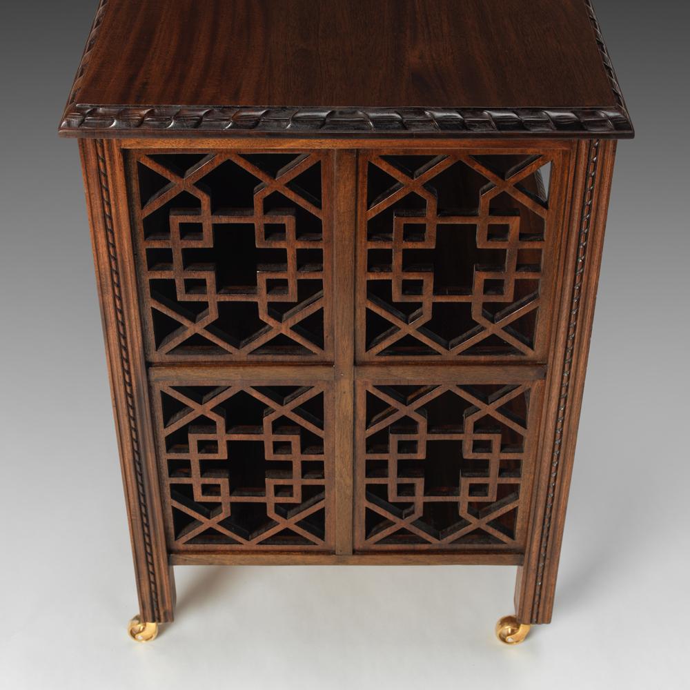 An exceptional George II design Chinese Chippendale mahogany open fret cabinet, suitable as a bedside or drawing room dwarf book cabinet. The Chippendale Fretted Open Cabinet is hand-polished with finely fretted ends and a fitted single