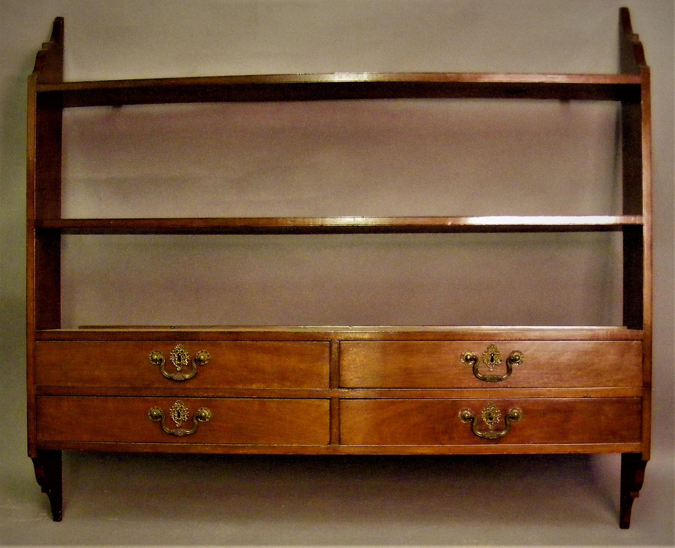 Chippendale mahogany open shelves with 4 oak lined drawers with key.