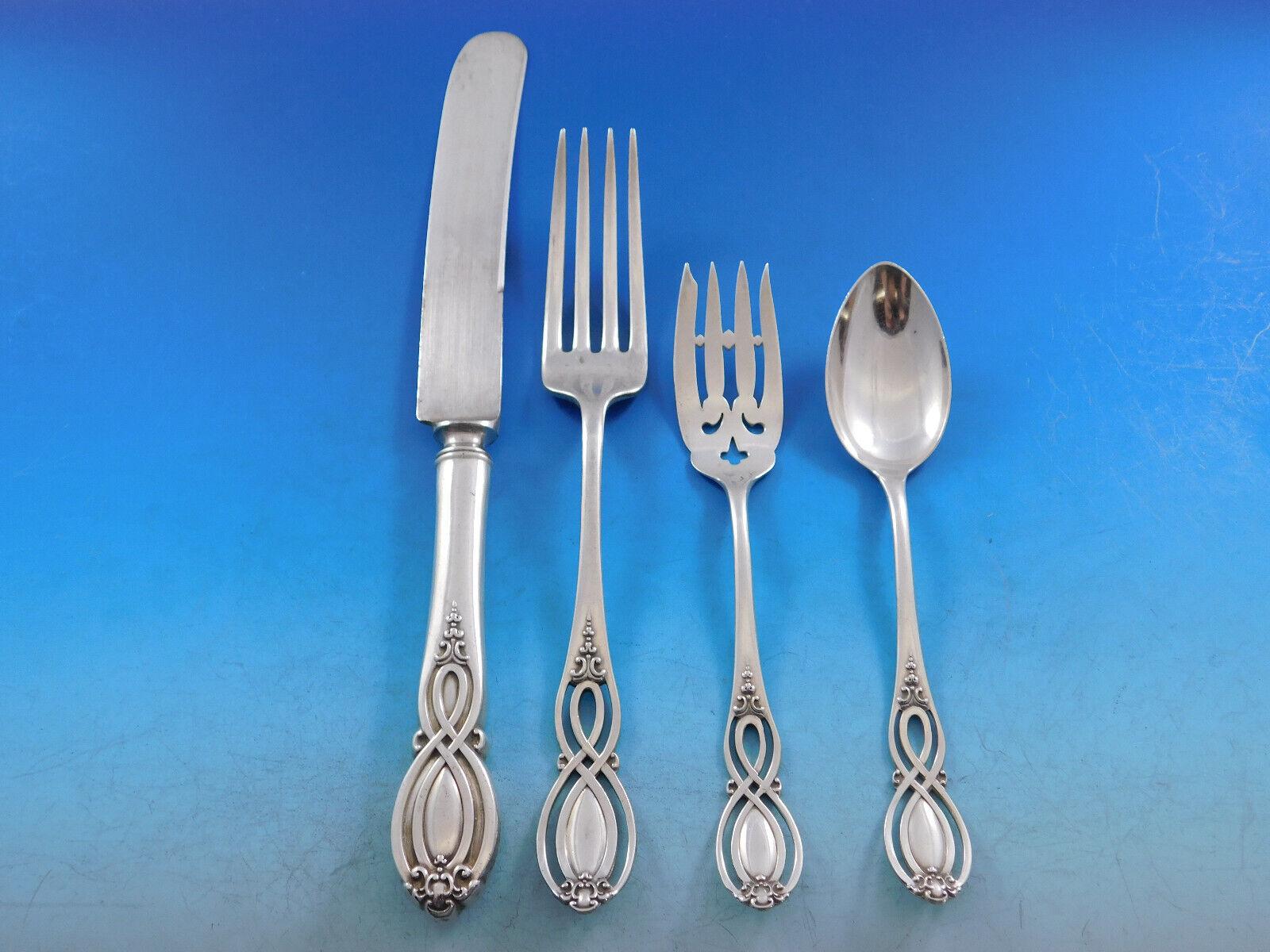 Rare Chippendale Old by Alvin, circa 1900, Sterling Silver Flatware set - 46 pieces. This pattern features a unique pierced handle. This set includes:

6 Dinner Size Knives w/blunt plated blades, 9 7/8