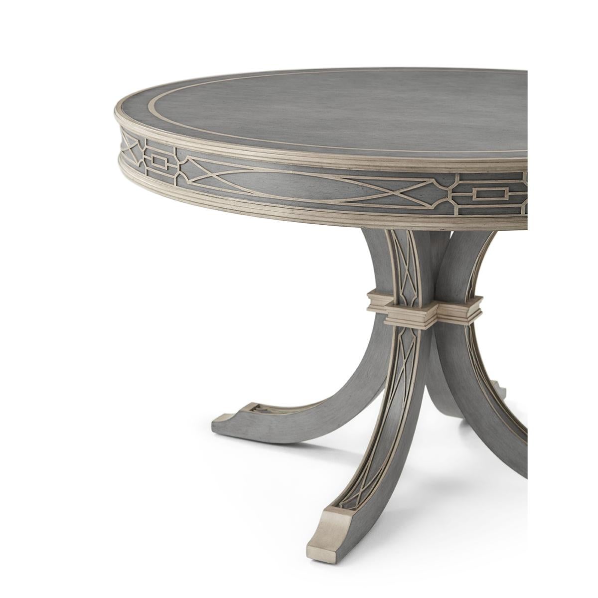 This elegant Grey Limestone finish painted center table with complimentary blind fretwork and trim. With a molded apron above four inswept solid legs joined with a carved collar.
An updated modern interpretation of the chinese chippendale influence