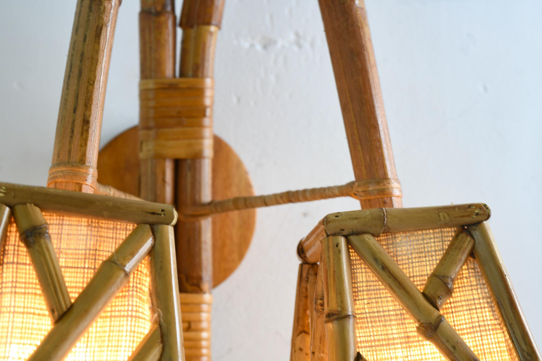 Constructed with precision, this Bamboo Vintage Style Wall Sconce adds an air of sophistication to any space. The chippendale pattern shade, carefully crafted with bamboo pieces and bent rattan, gives off a nostalgic vibe. Ideal for setting a cozy
