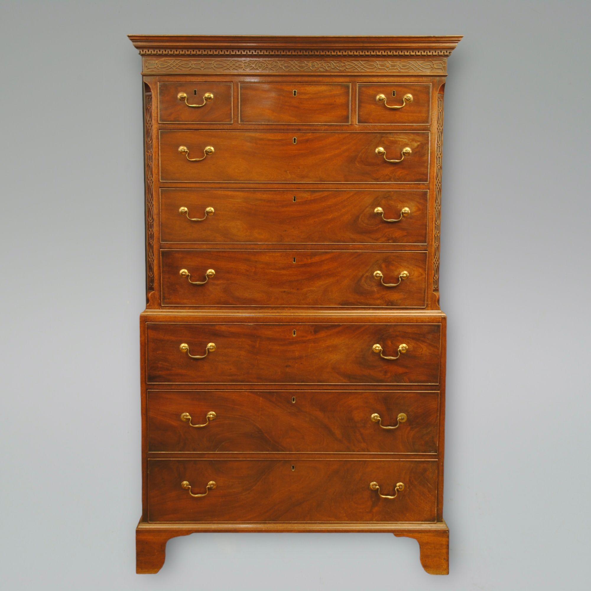A George III period mahogany tallboy with blind fret decoration to the frieze below the cornice and on the canted corners. Original swanneck brass handles and lovely grain on the drawer fronts. 
Superb colour and patiation.
Circa 1775