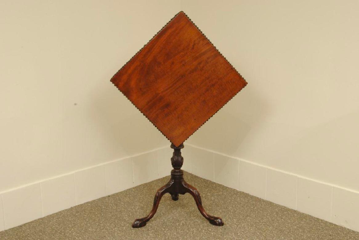 An elegant Chippendale period mahogany carved tripod table with acanthus carving on the stem and claw feet to the legs. The original square top with gadrooned carving to the edge.
Good colour and fine quality carving to the stem
Circa 1780.